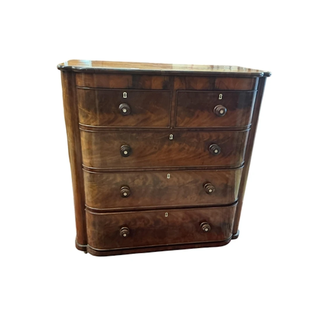A Victorian mahogany barrel fronted chest of drawers, two sh...