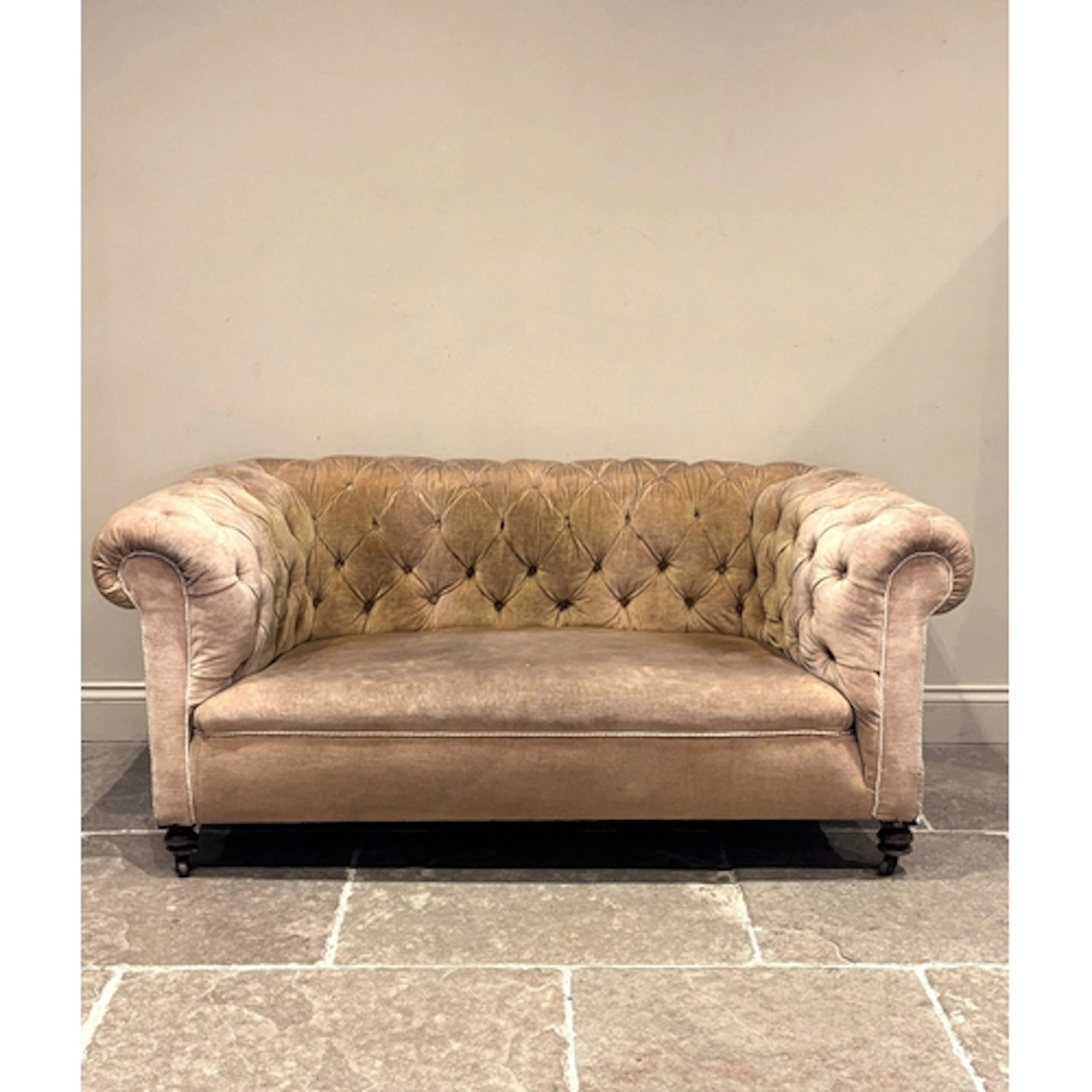 A Victorian Chesterfield type sofa, with upholstered button ...