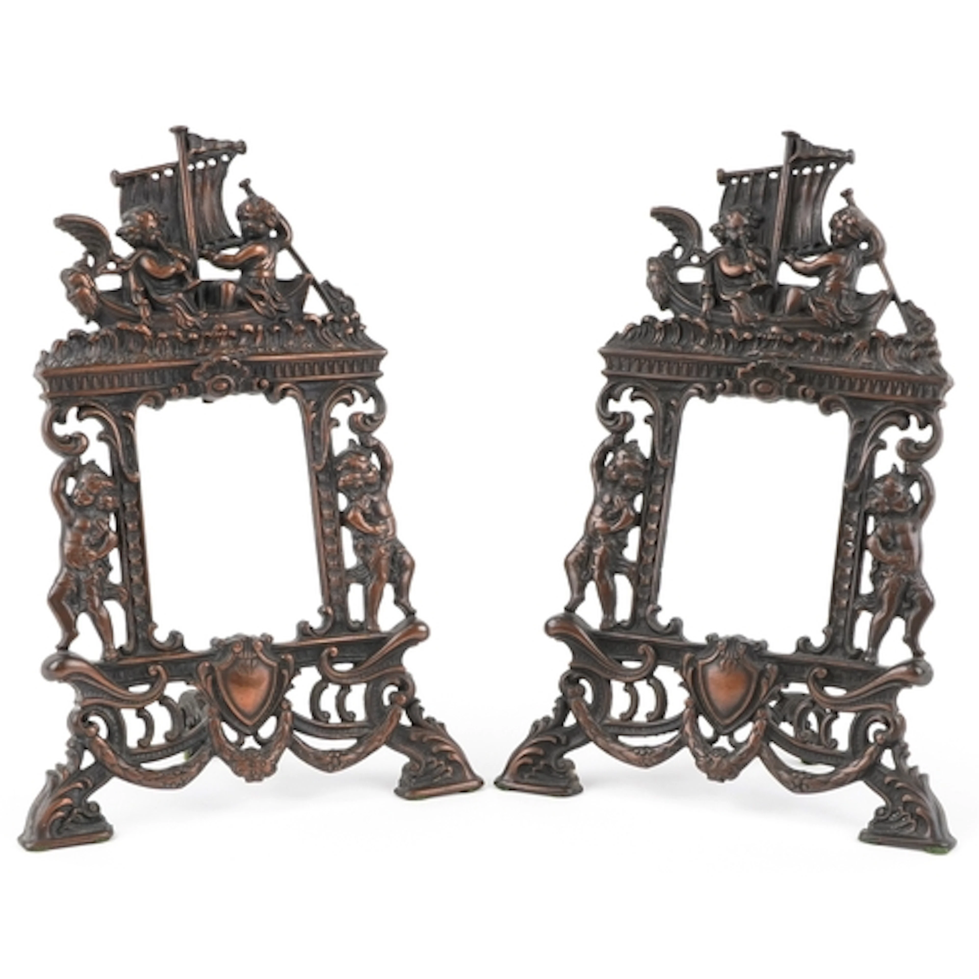 A pair of Art Nouveau cast iron photo frames embossed with P...