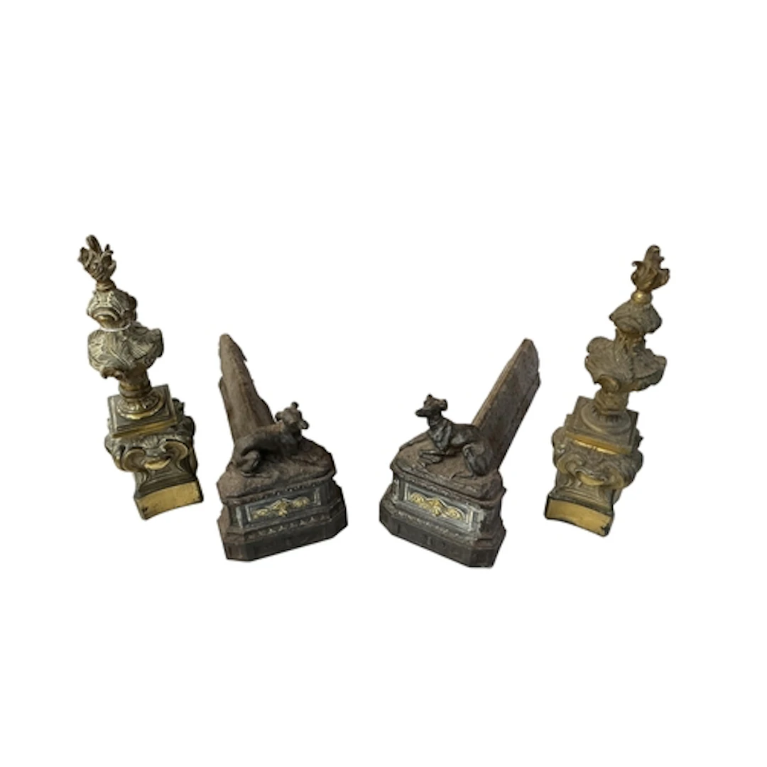 A pair of Victorian brass and cast iron fire dogs with flamb...