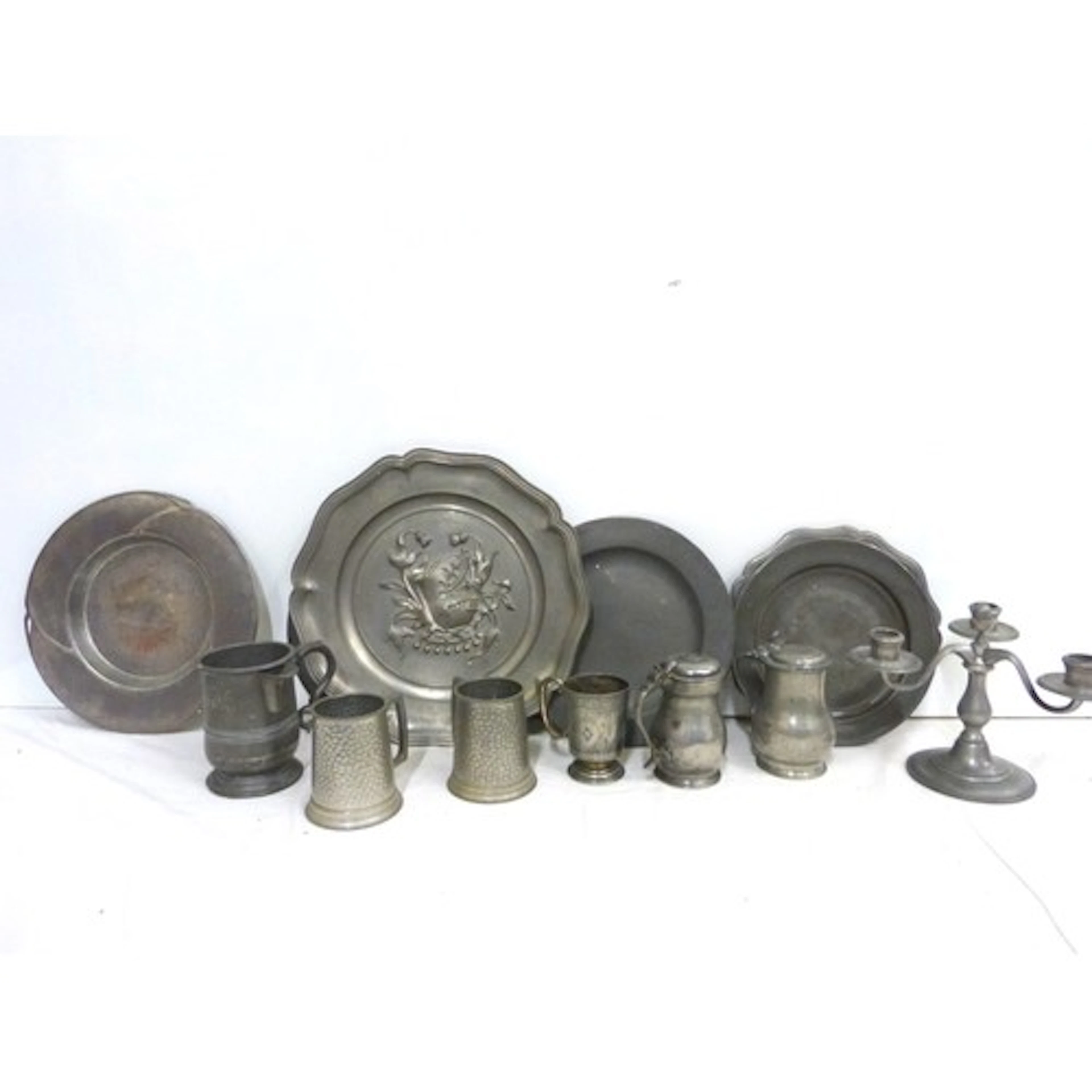 Collection of antique pewter to include plates, candle holde...