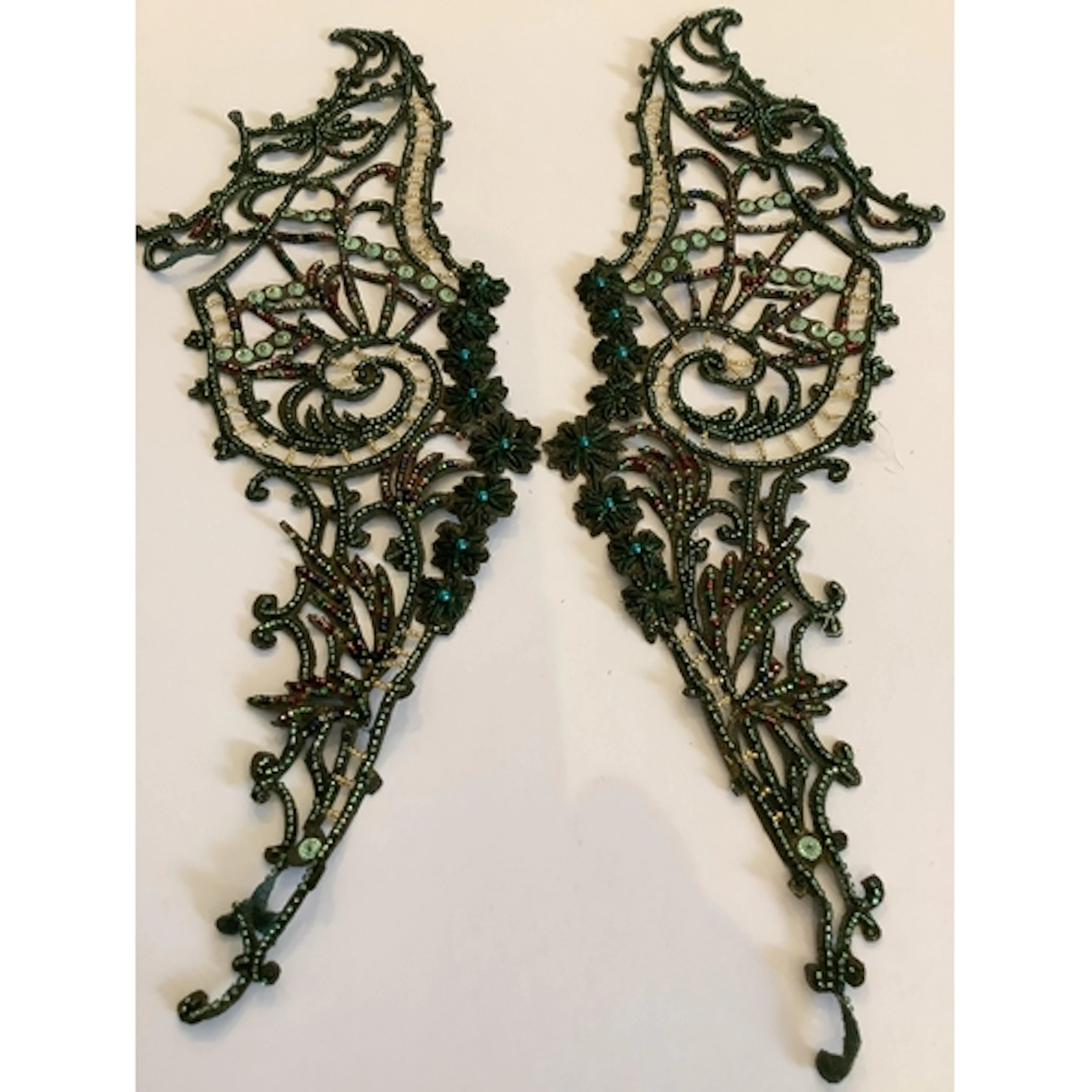 A collection of green and bronze metallic beading to include...