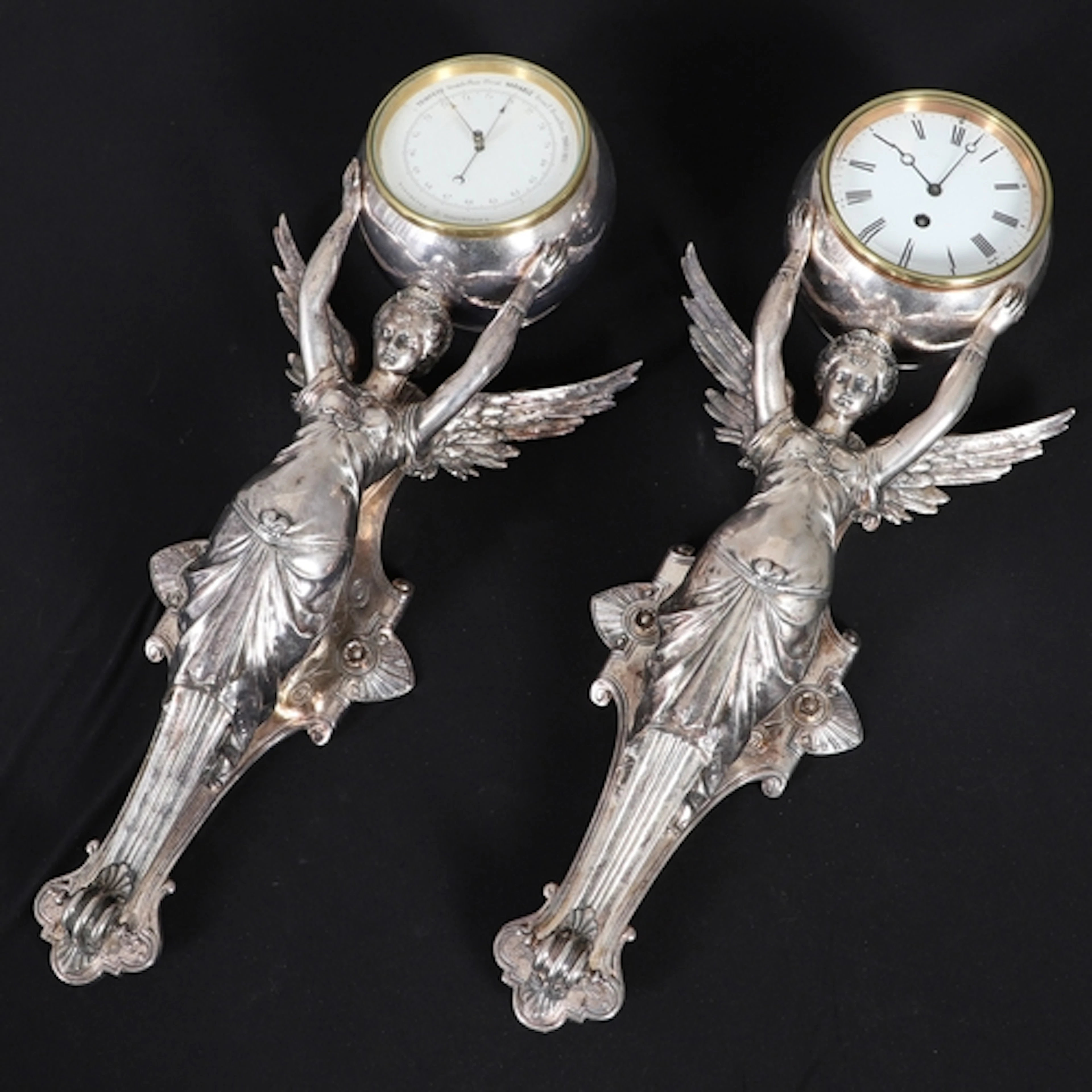 A FRENCH BRONZE CAST AND NICKEL-PLATED TIMEPIECE AND MATCHIN...
