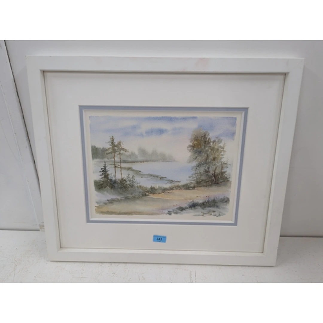 A watercolour framed and glazed, depicting a lake scene with...