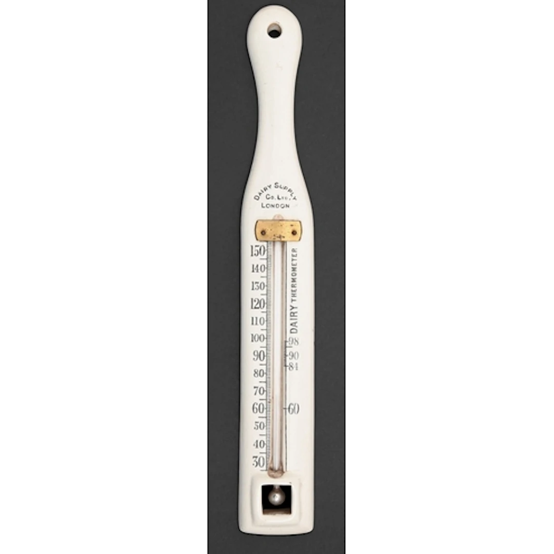Advertising. A dairyman's white earthenware hanging thermome...