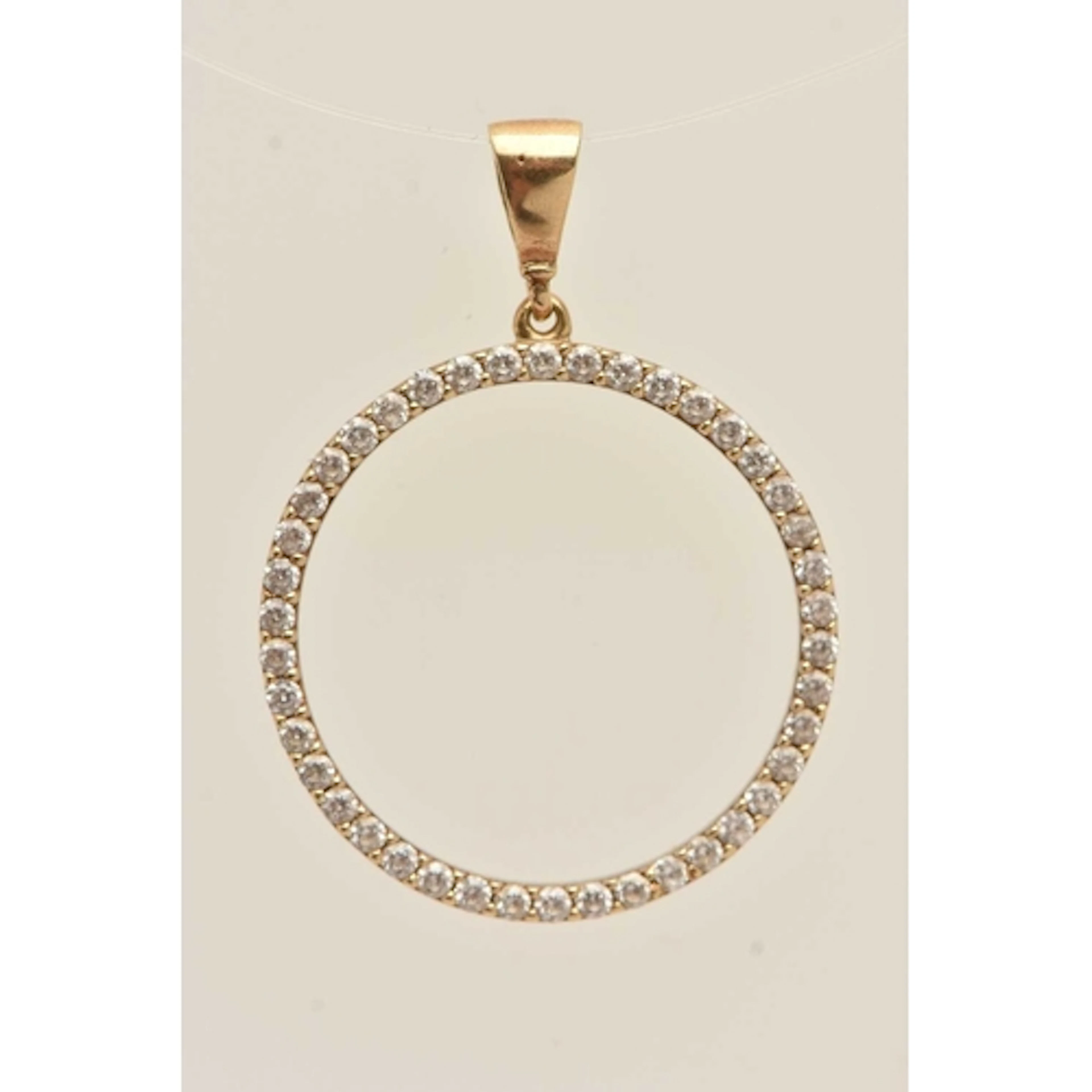 A 9CT GOLD DIAMOND PENDANT, of an open work circular form, s...