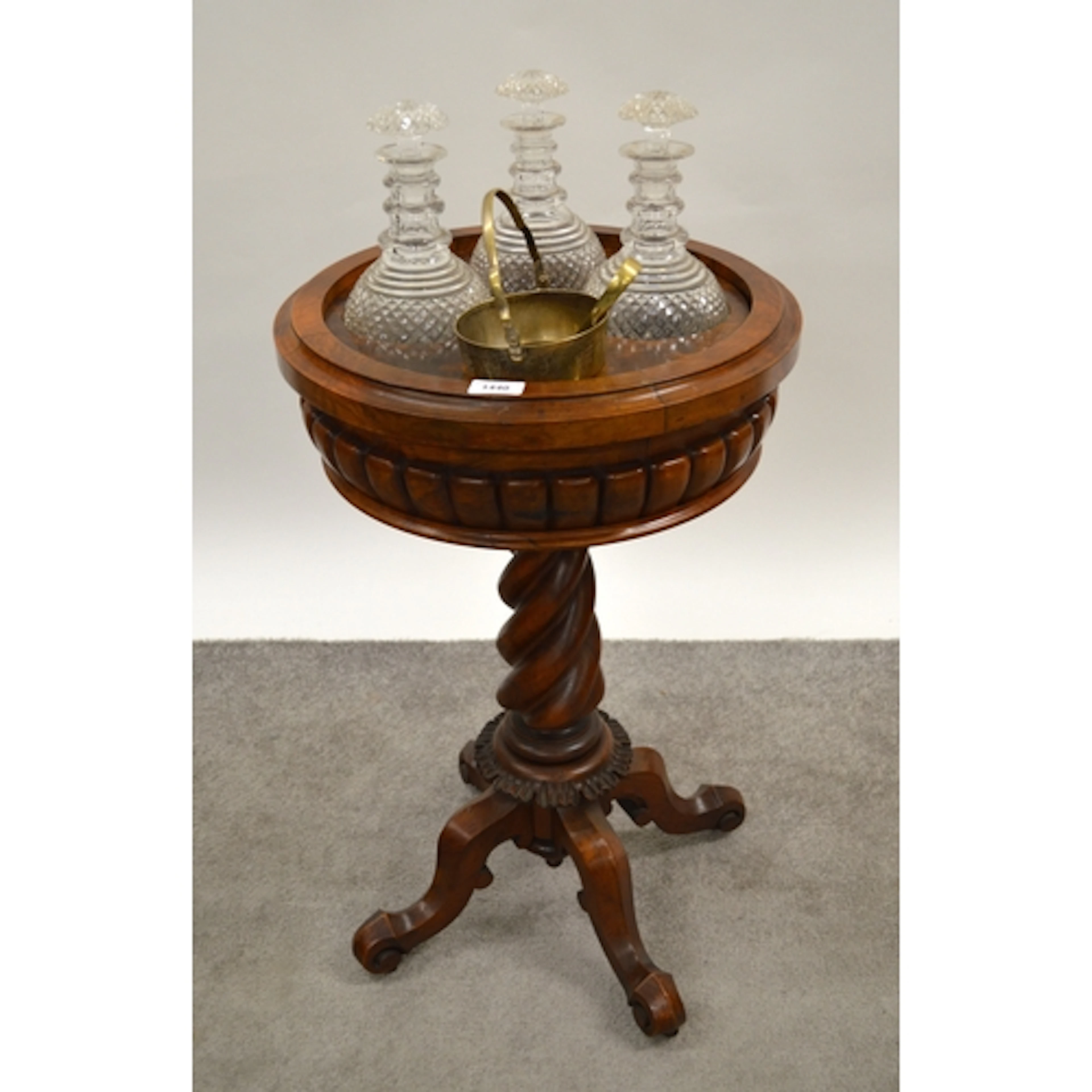 Figured walnut drinks stand, the circular recessed moulded t...