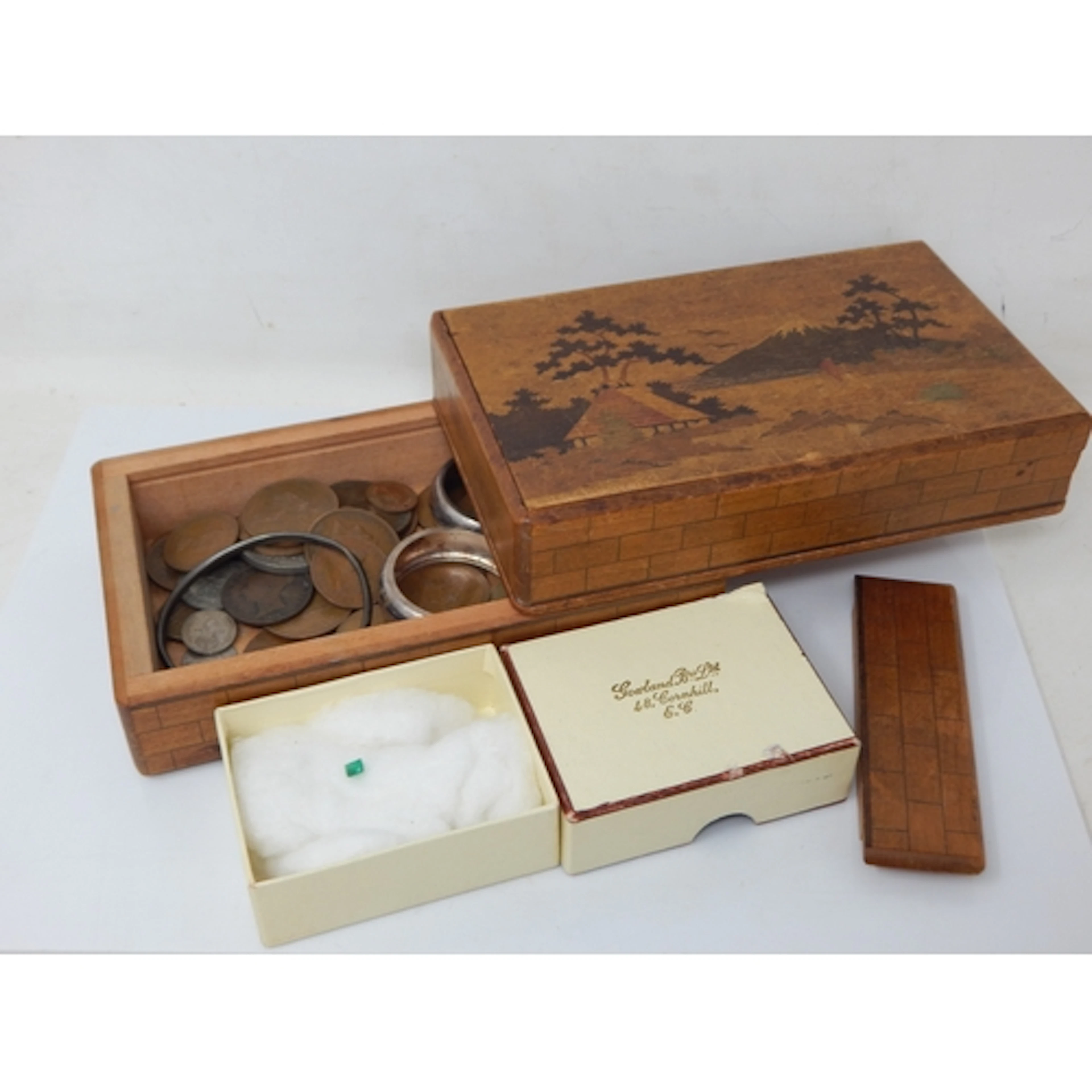 A Wooden Puzzle Box Containing an Emerald Gemstone & Coins I...
