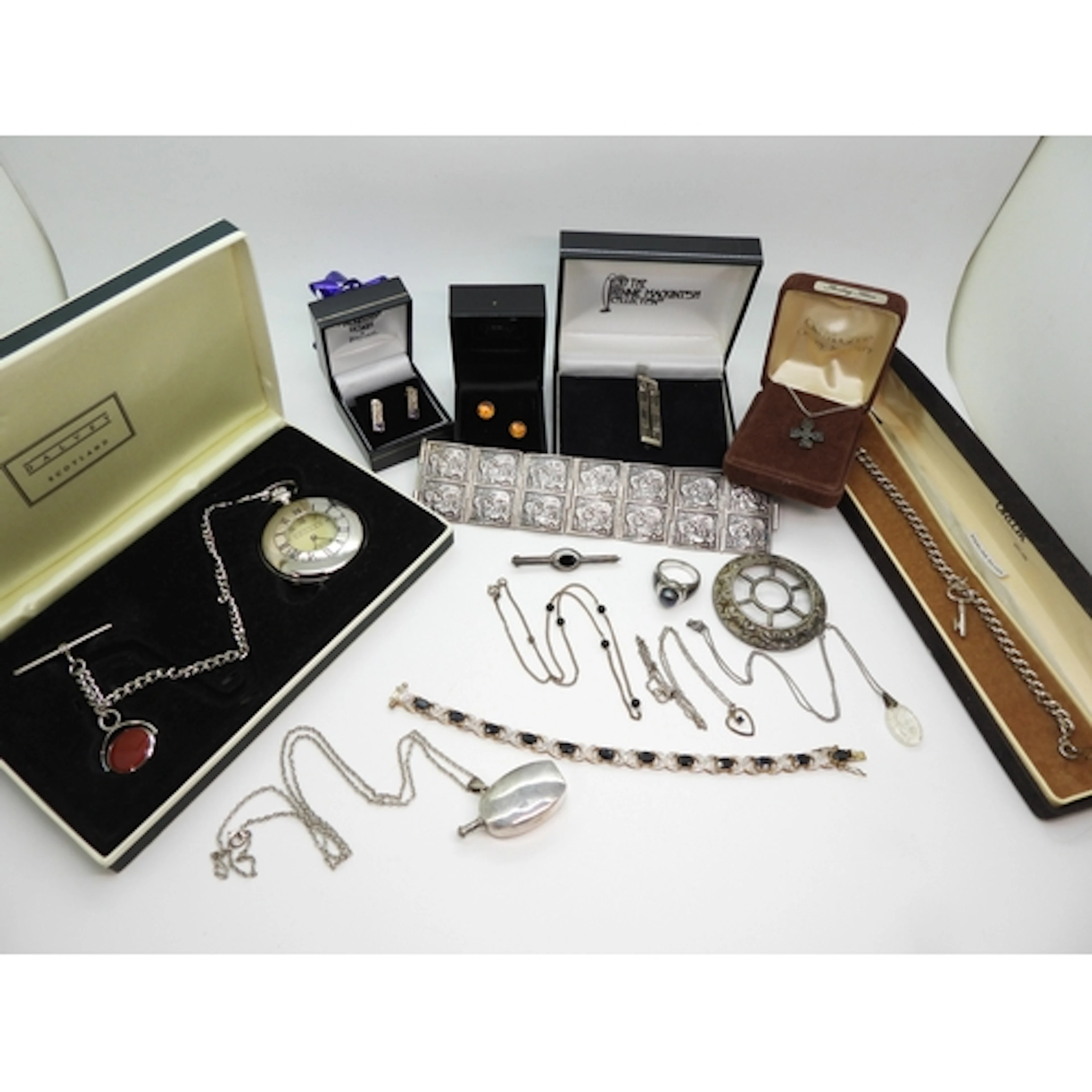 A silver early Ola Gorie cross pendant in original box, a si...
