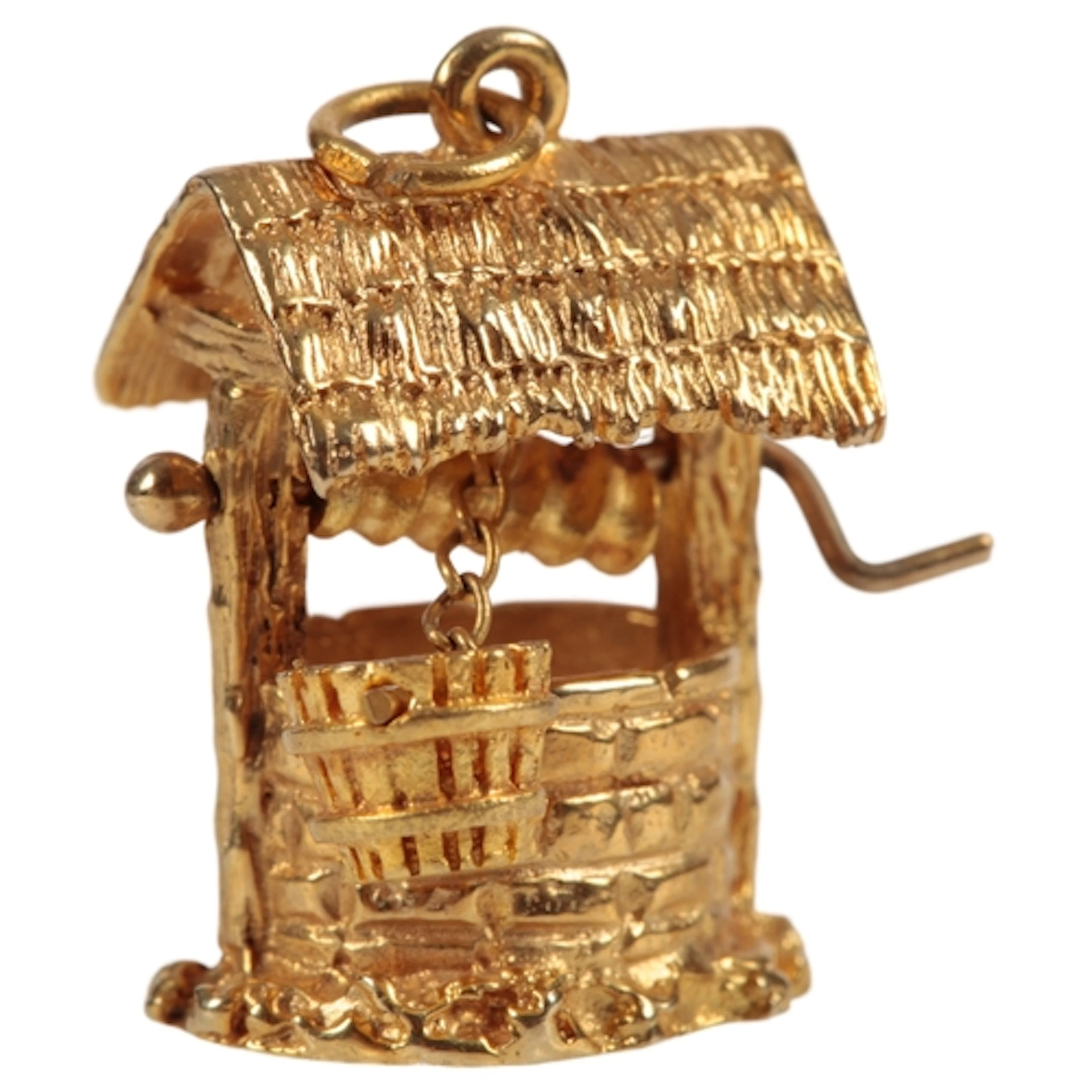 A 9ct gold charm, circa 1965, designed as a well with rotati...