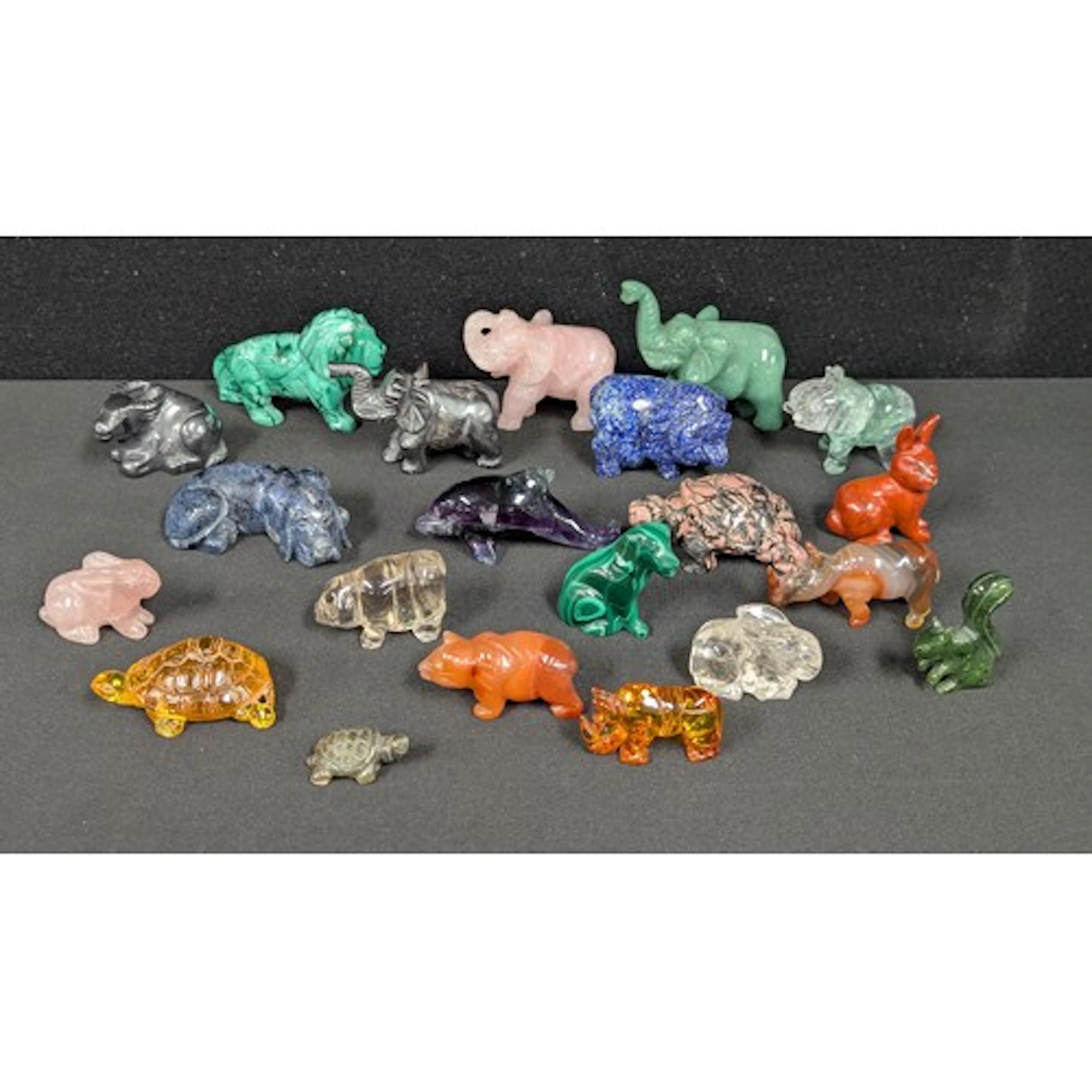 A collection of carved stone animals inc Lapis lazuli Hog, H...