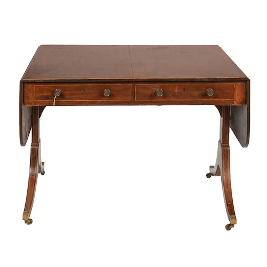 A George IV mahogany sofa table, crossbanded in rosewood, fi...