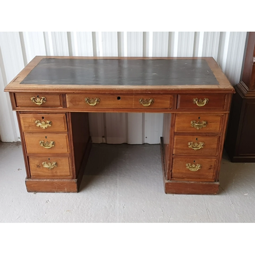 A nine drawer Desk with leather inset top, 2ft 3" H 3ft 11" ...