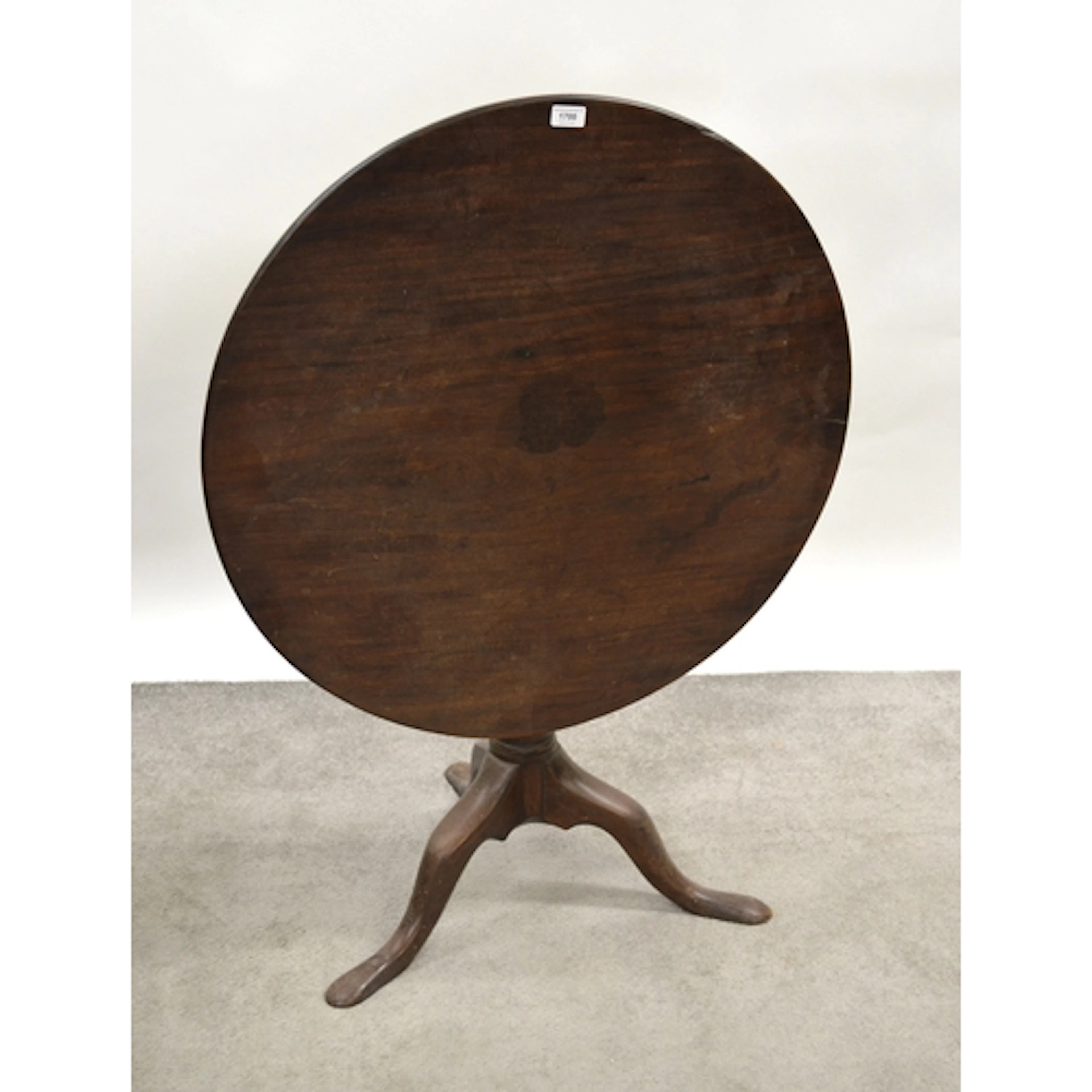 George III circular mahogany tilt top pedestal table, on tri...