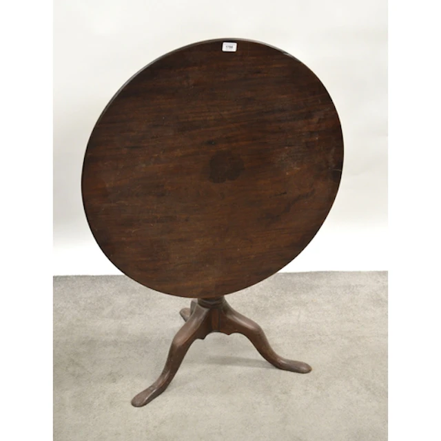 George III circular mahogany tilt top pedestal table, on tri...