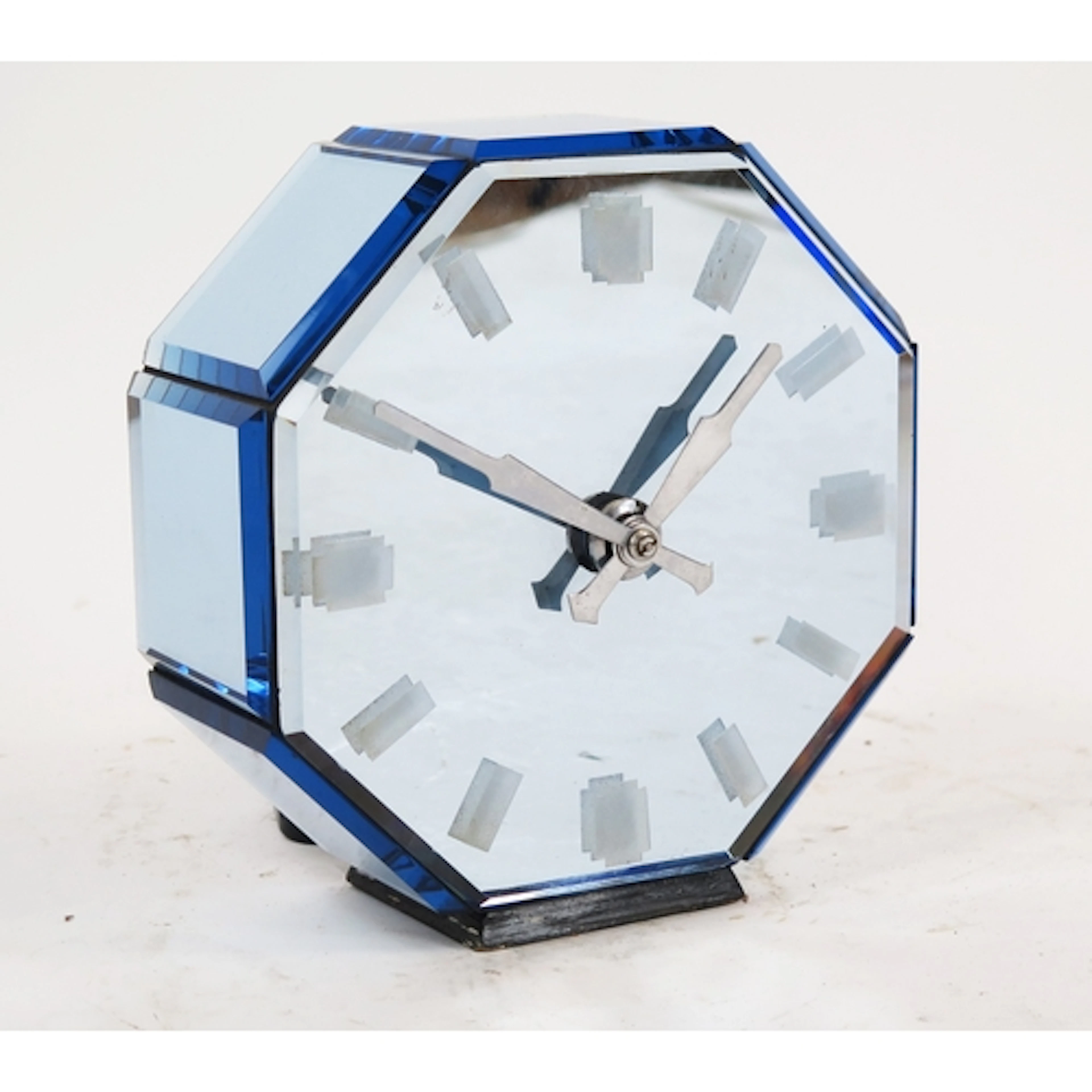 An Art Deco style glass electric mantle timepiece, of octago...