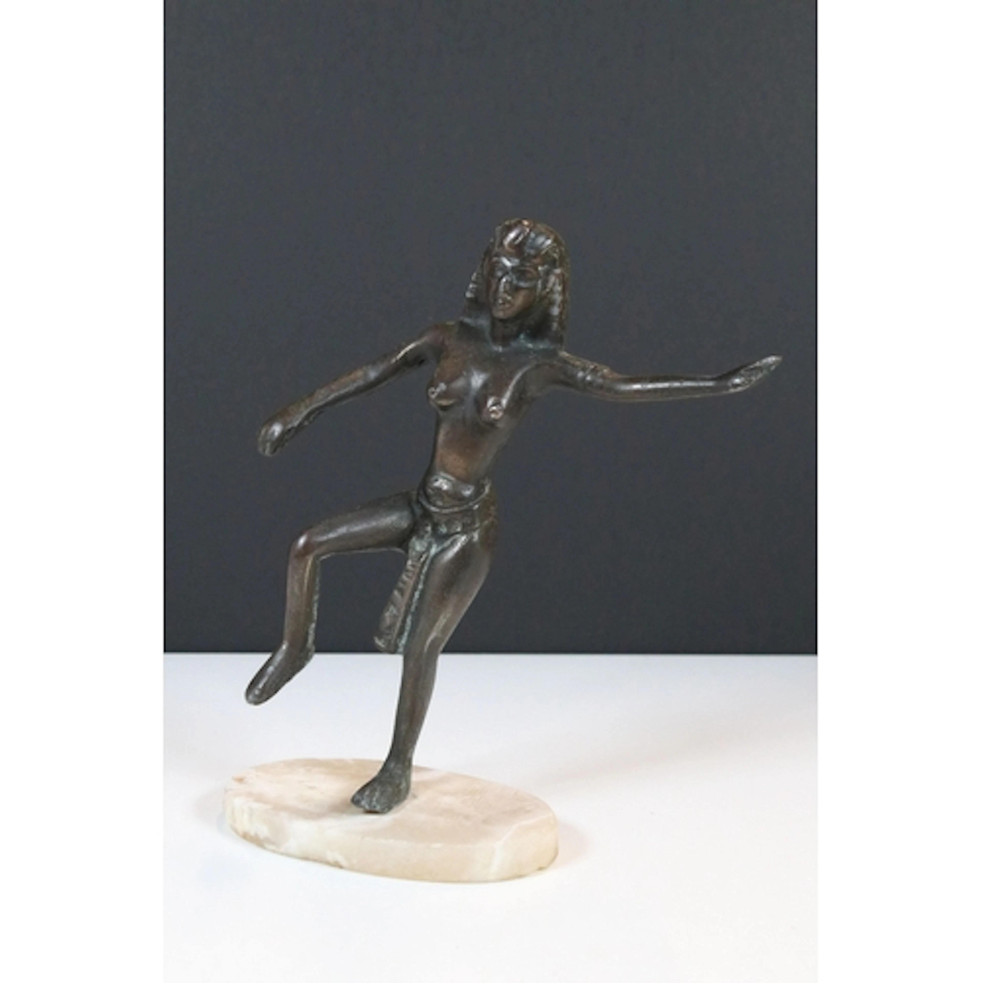 Art Deco style bronzed metal figure of a semi-naked Egyptian...