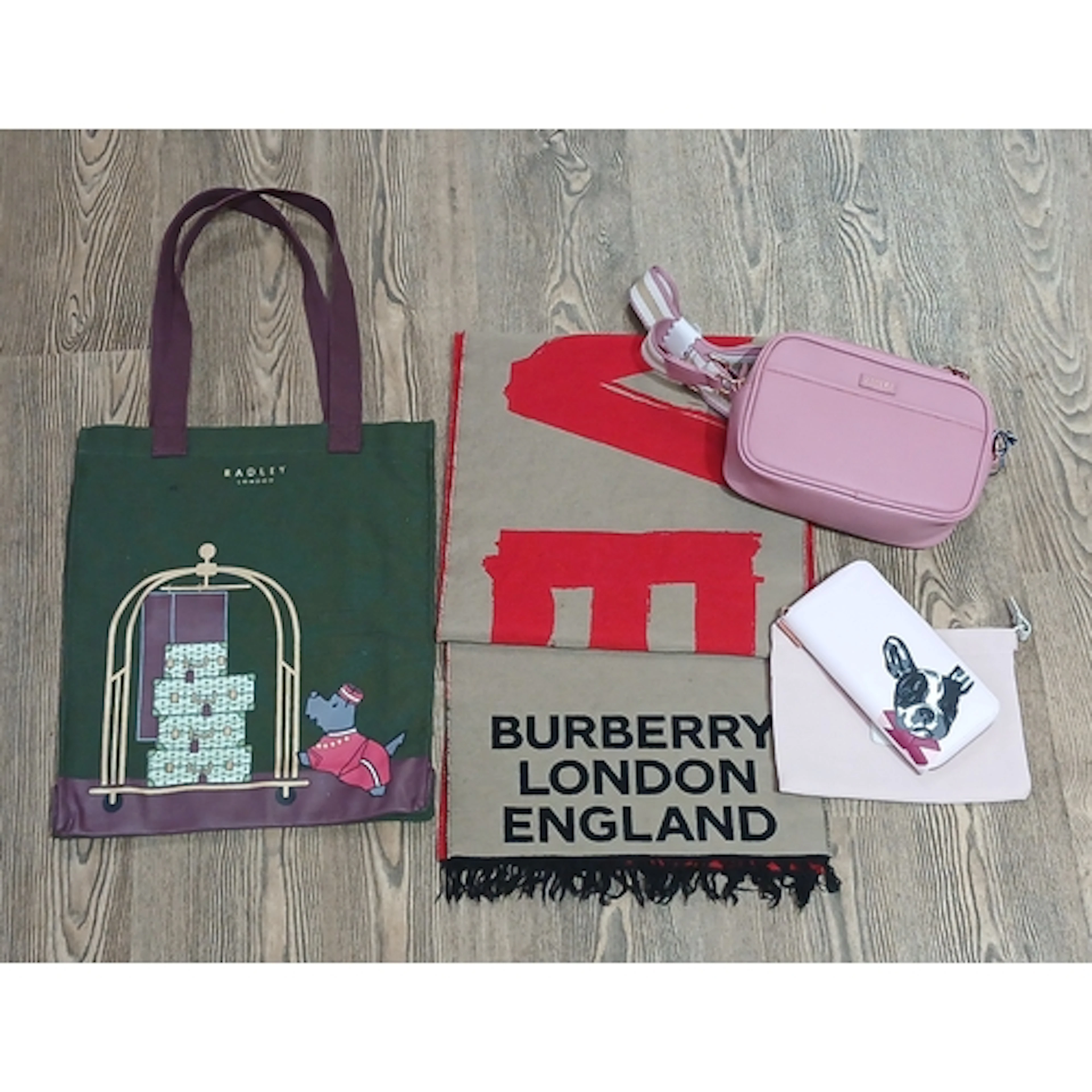 A mixed lot comprising a Burberry wool scarf, a Joules pink ...