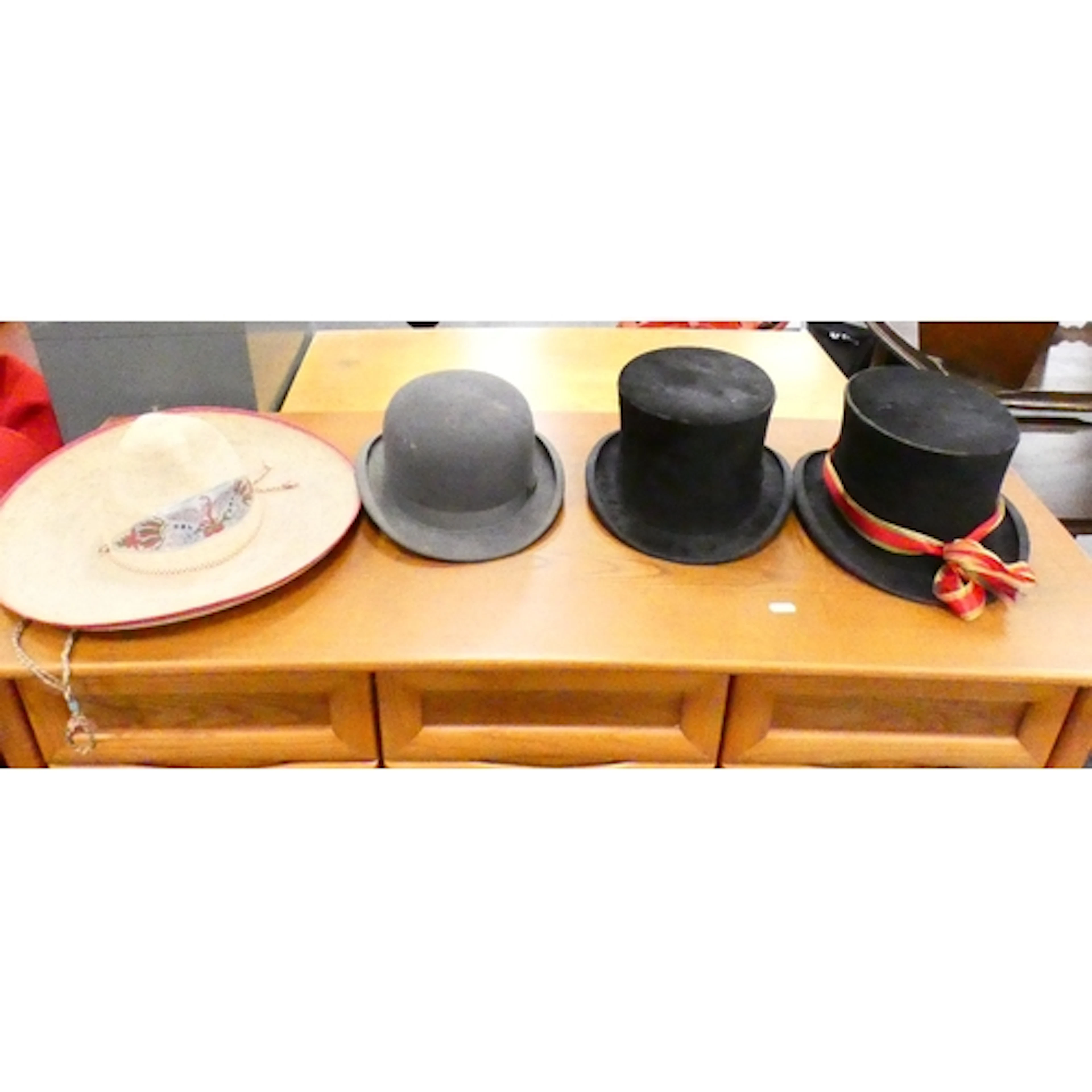 Two vintage black silk top hats, one stamped to interior for...