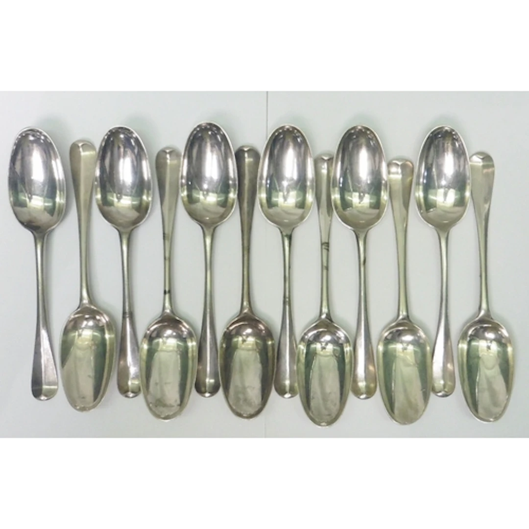 A matched set of twelve George I rat tailed table spoons bea...