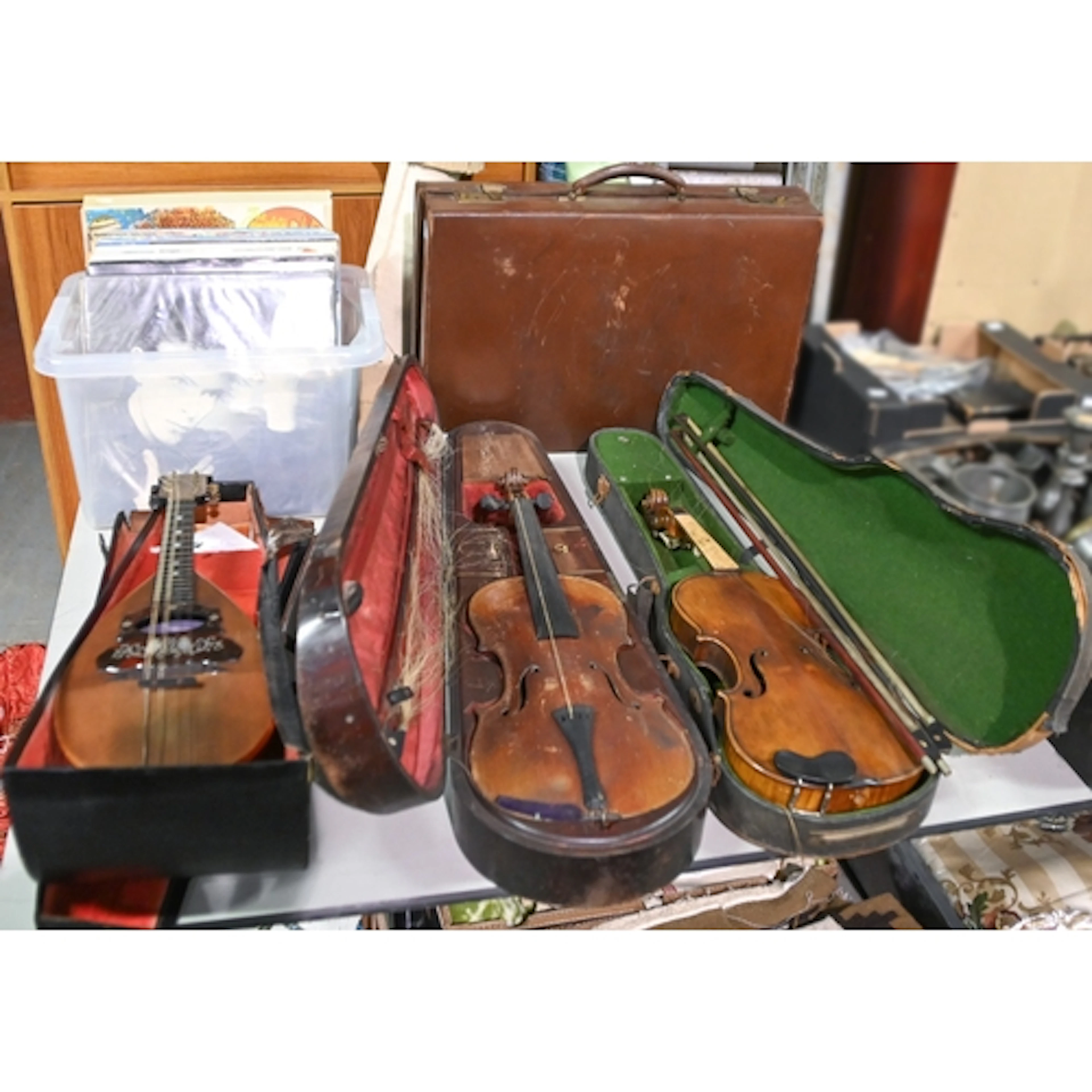 An early 20th century violin, in fitted mahogany case, anoth...