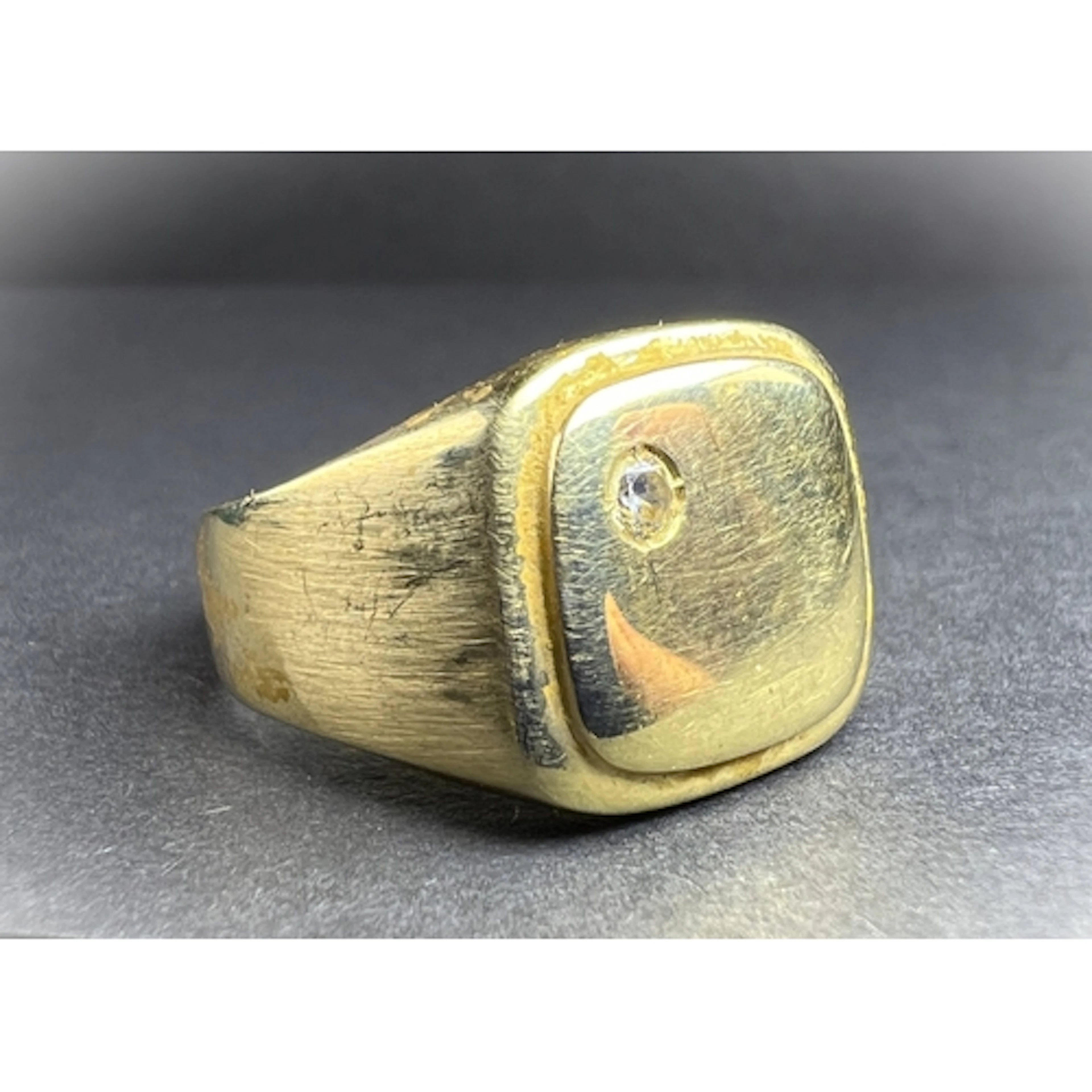 A yellow metal signet ring stamped 585 and set with a single...