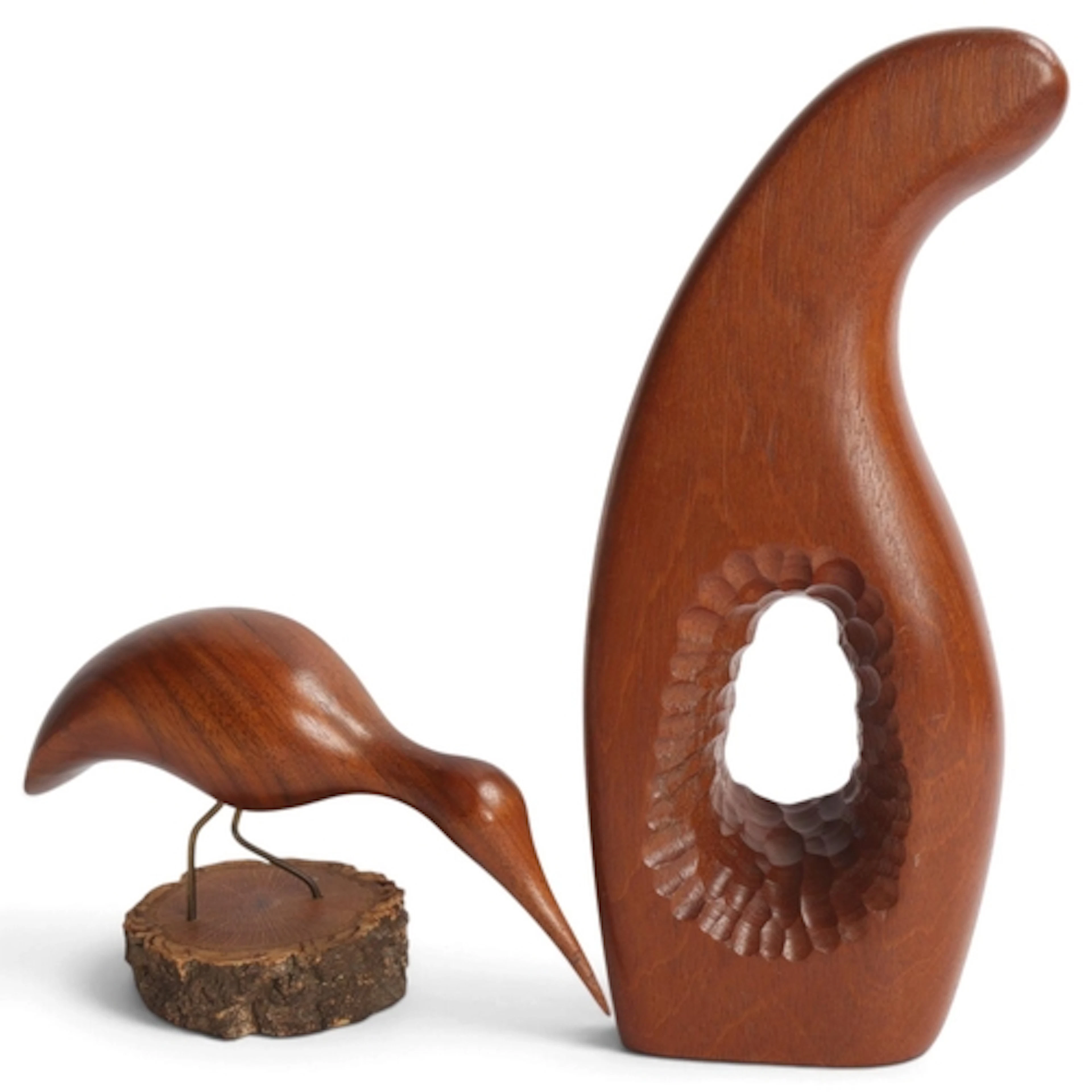A mid century teak carved sculpture together with a hand car...