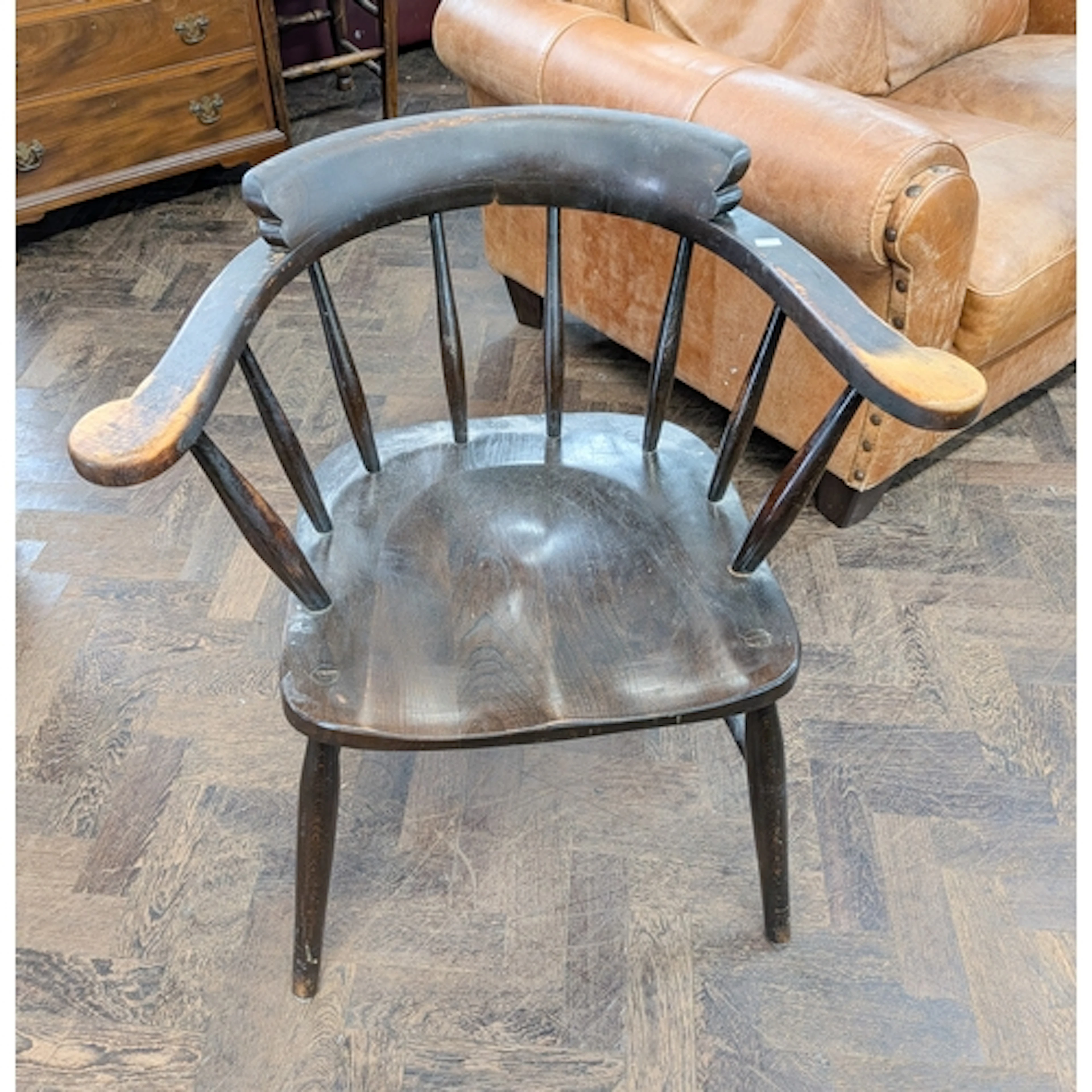 A tub shaped Windsor spindle back elbow chair