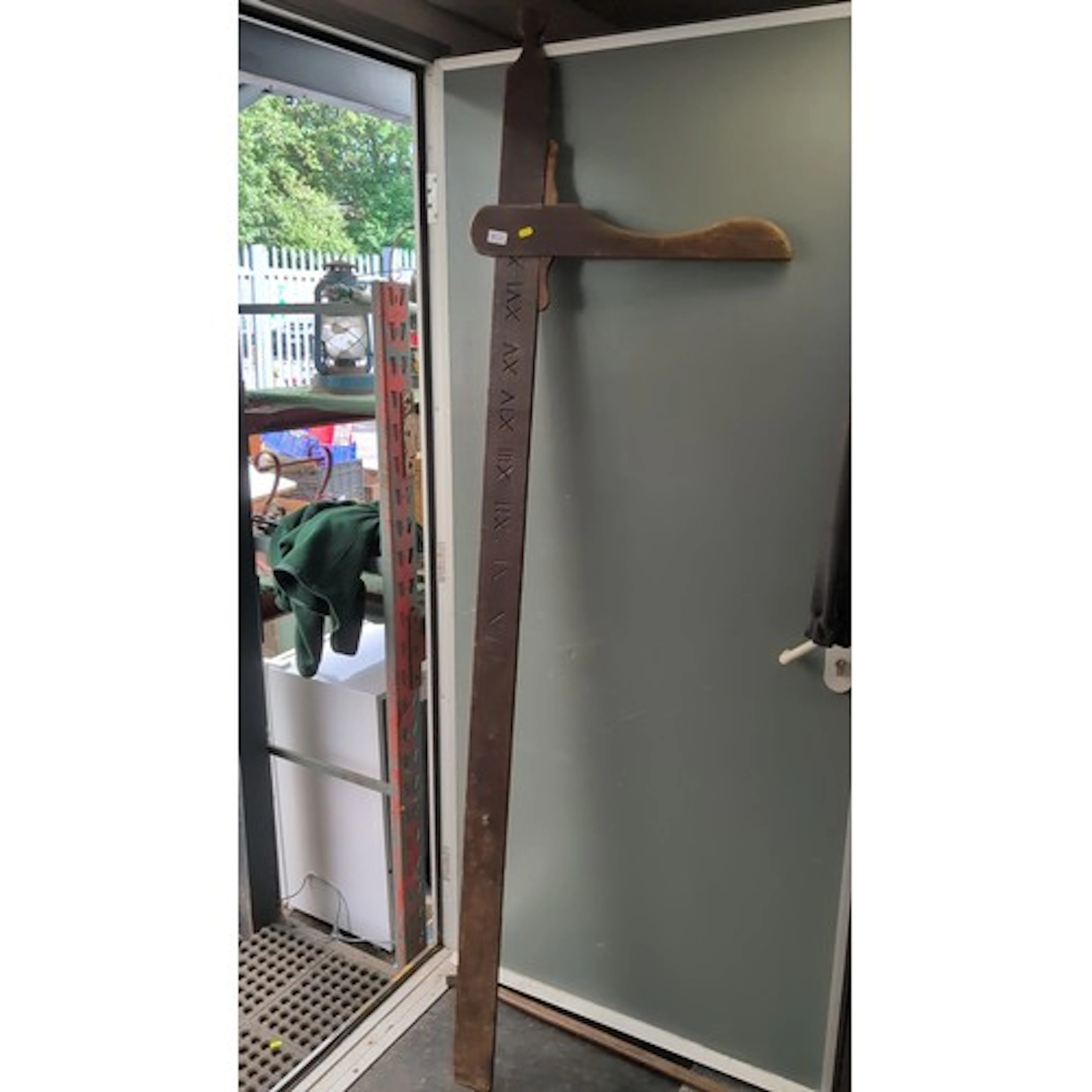 Carved wooden measuring stick, probably a cooper’s or brewer...