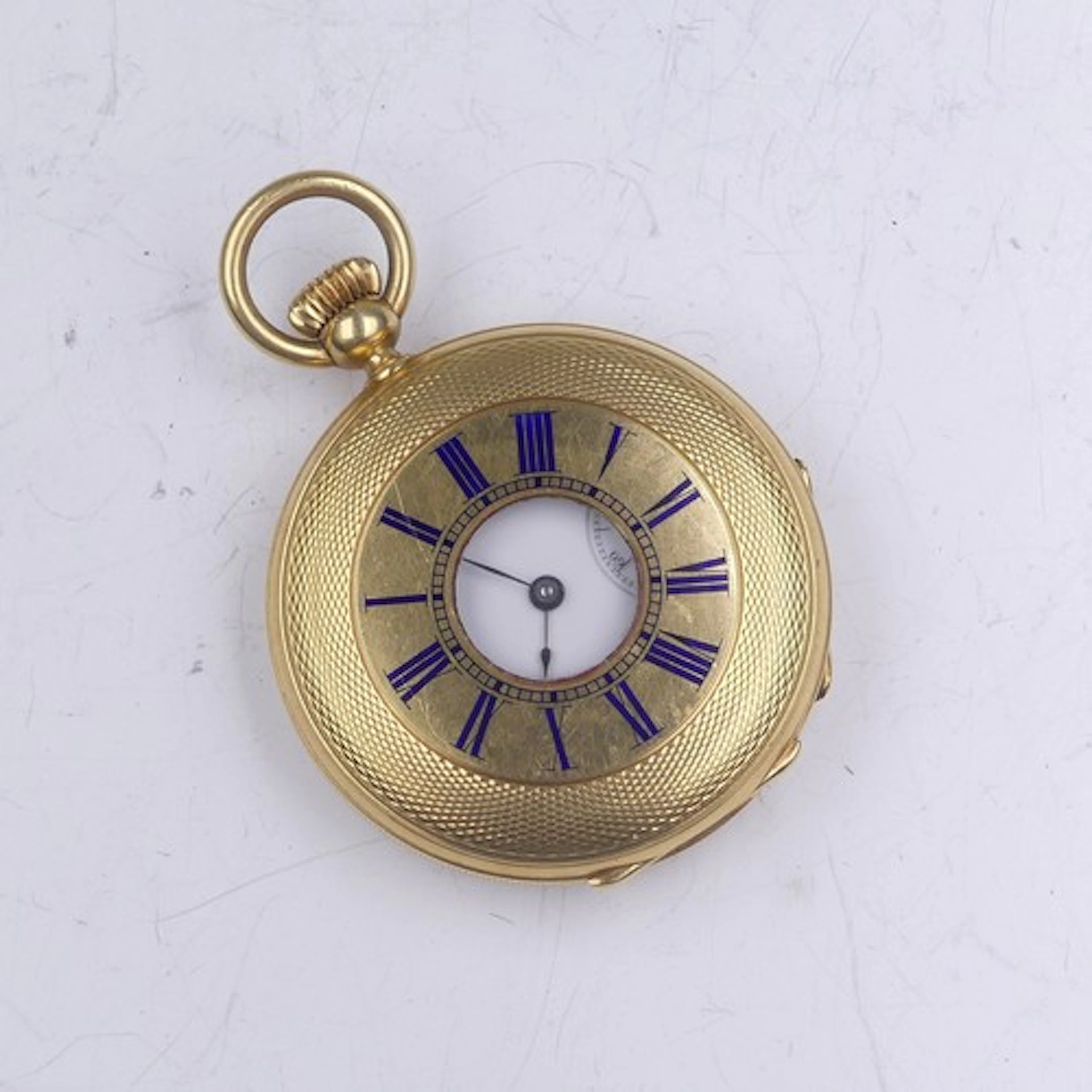 An 18ct gold half hunter Pocket Watch, unsigned white enamel...
