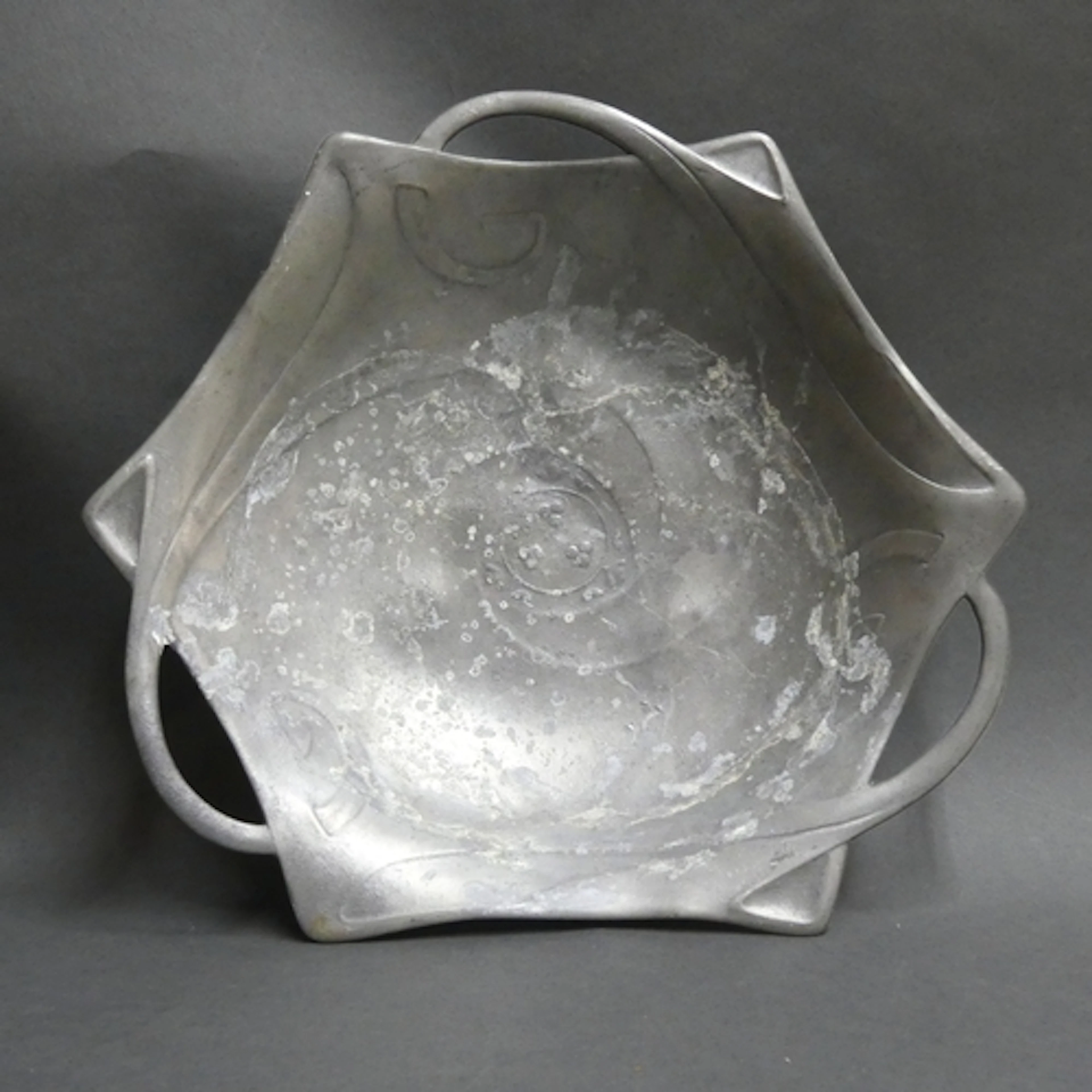 An unusual tri-handled Art Nouveau pewter serving bowl of na...