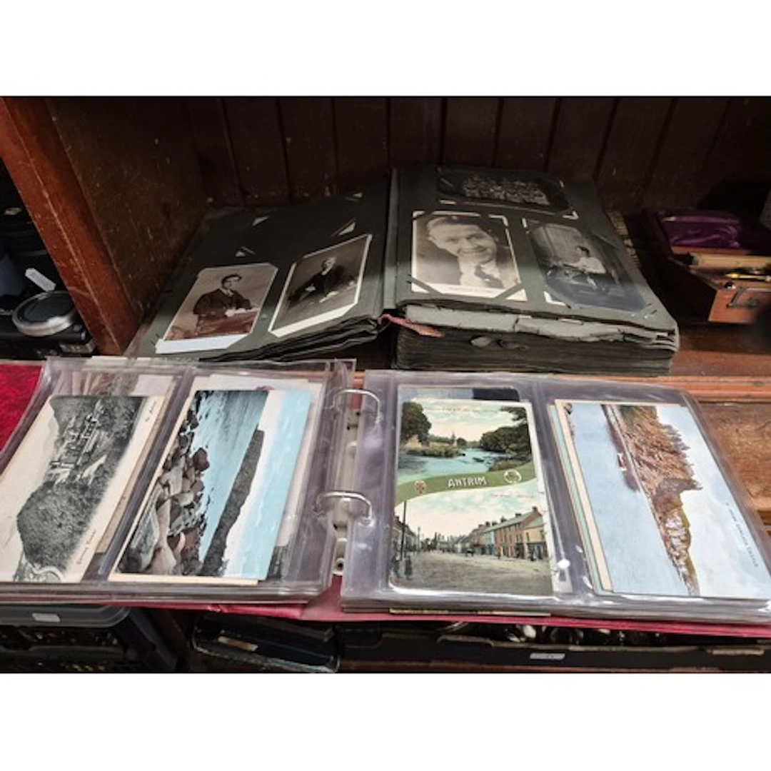 An album of vintage photographs and an album of vintage post...