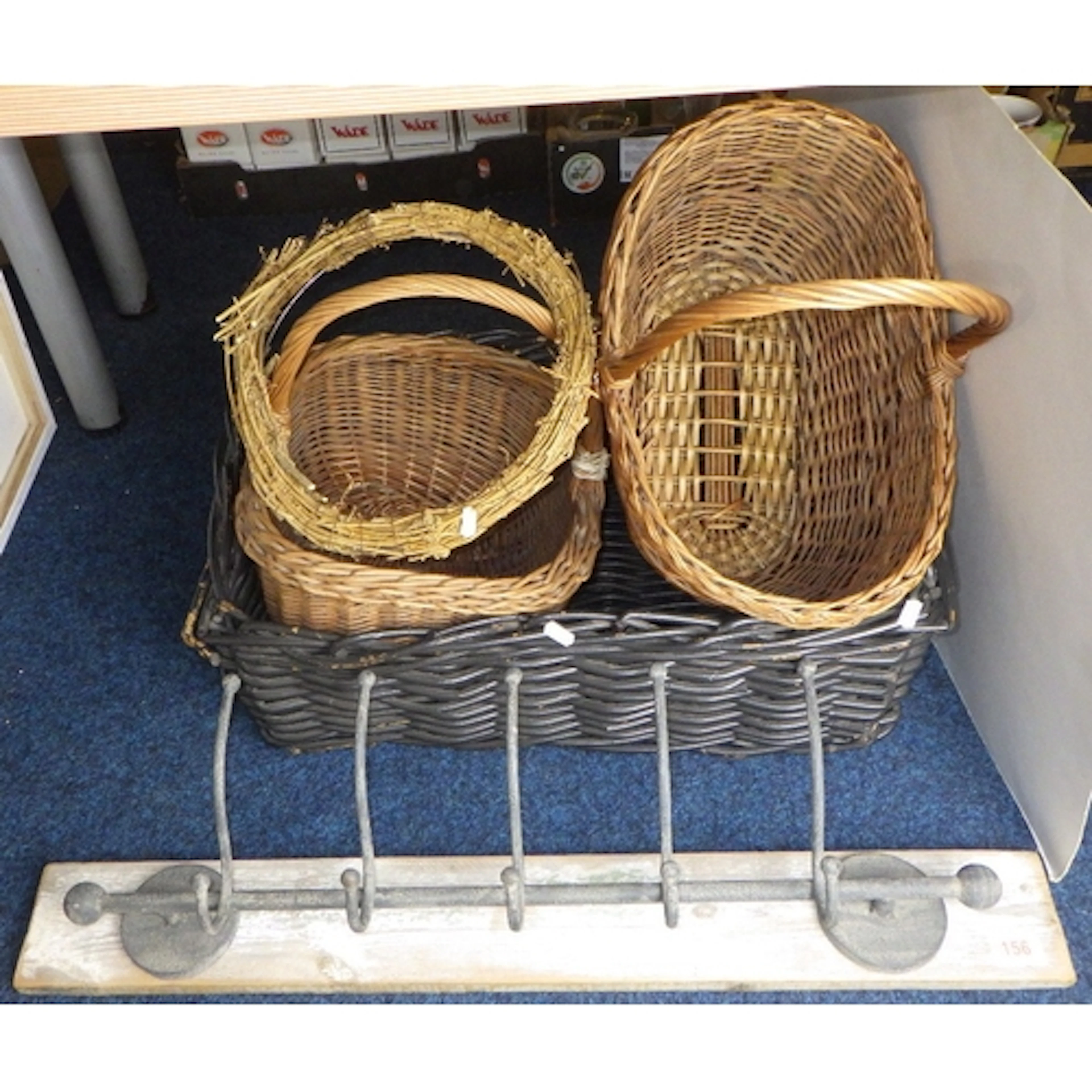 A group of baskets and a coat rack