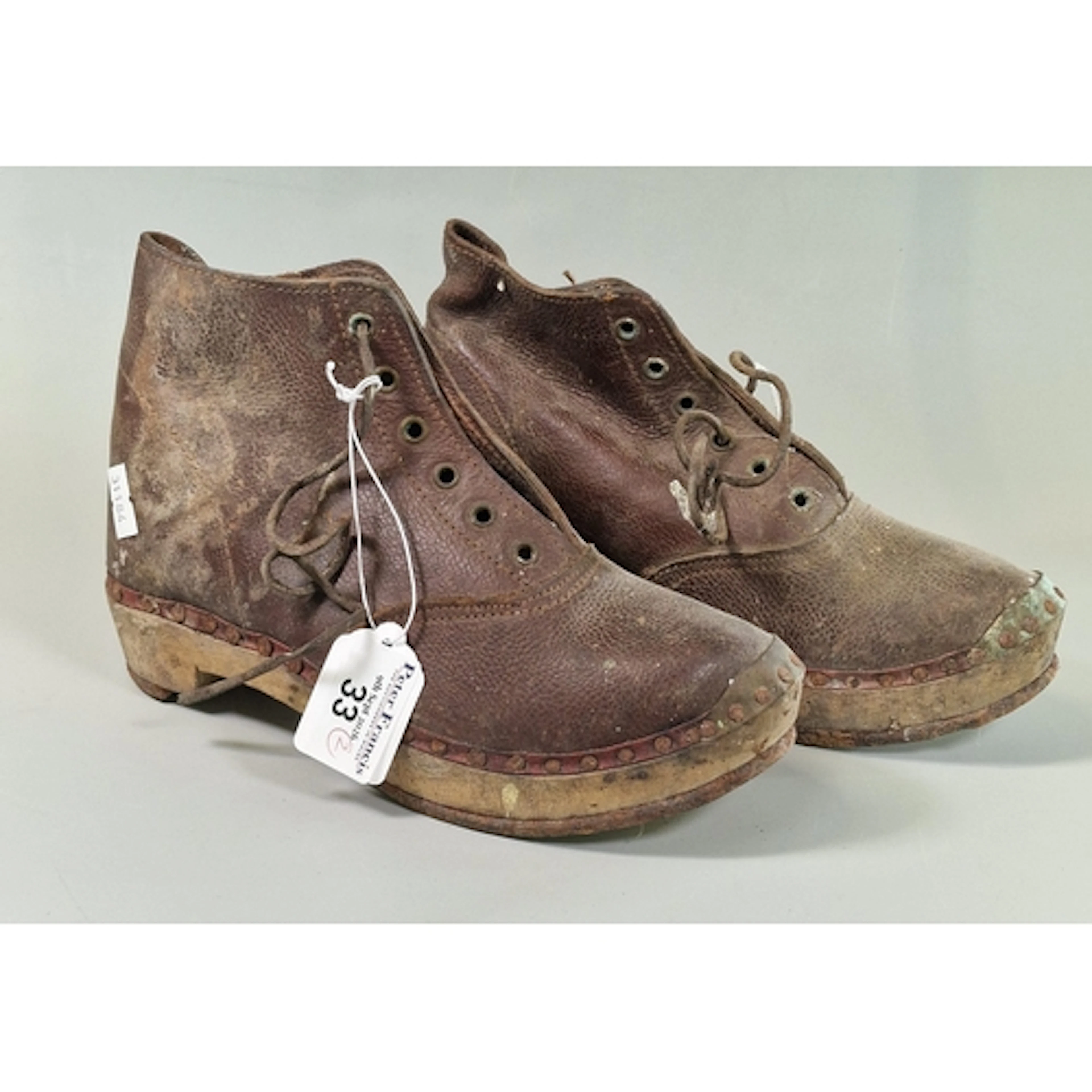 Pair of vintage clogs with metal studwork and metal horse sh...