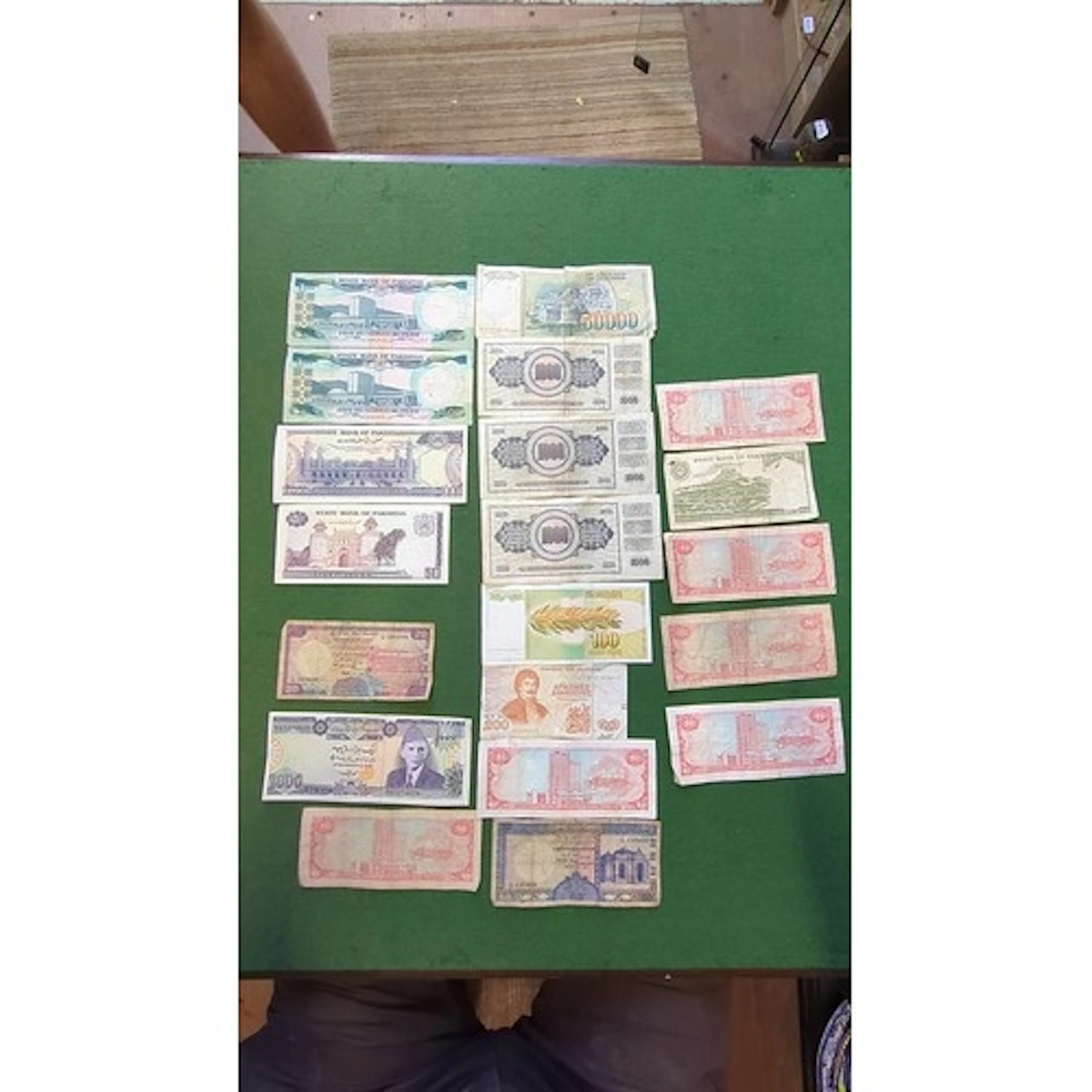 A group of world banknotes, including State Bank of Pakistan...