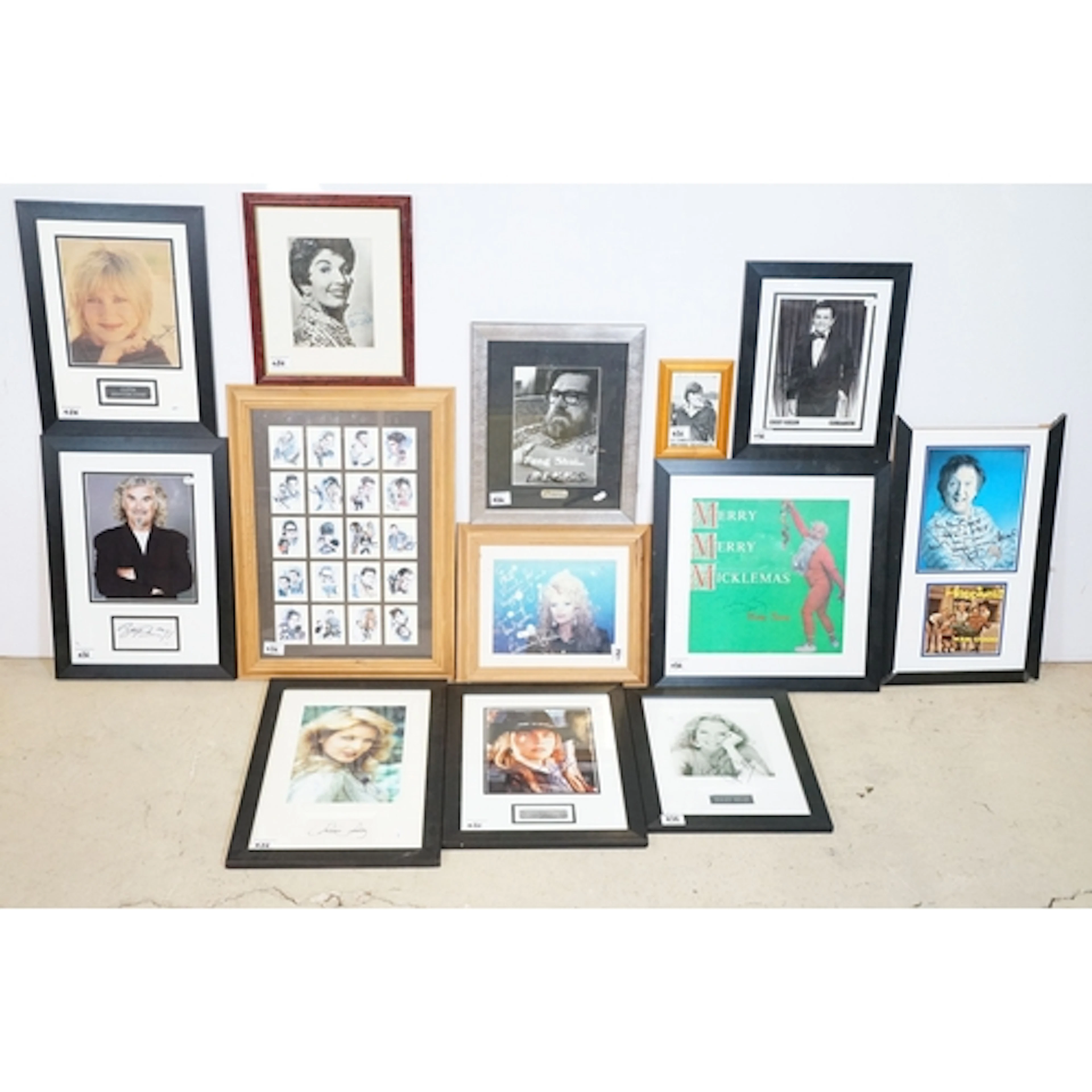 Group of framed and glazed celebrity autographs to include M...