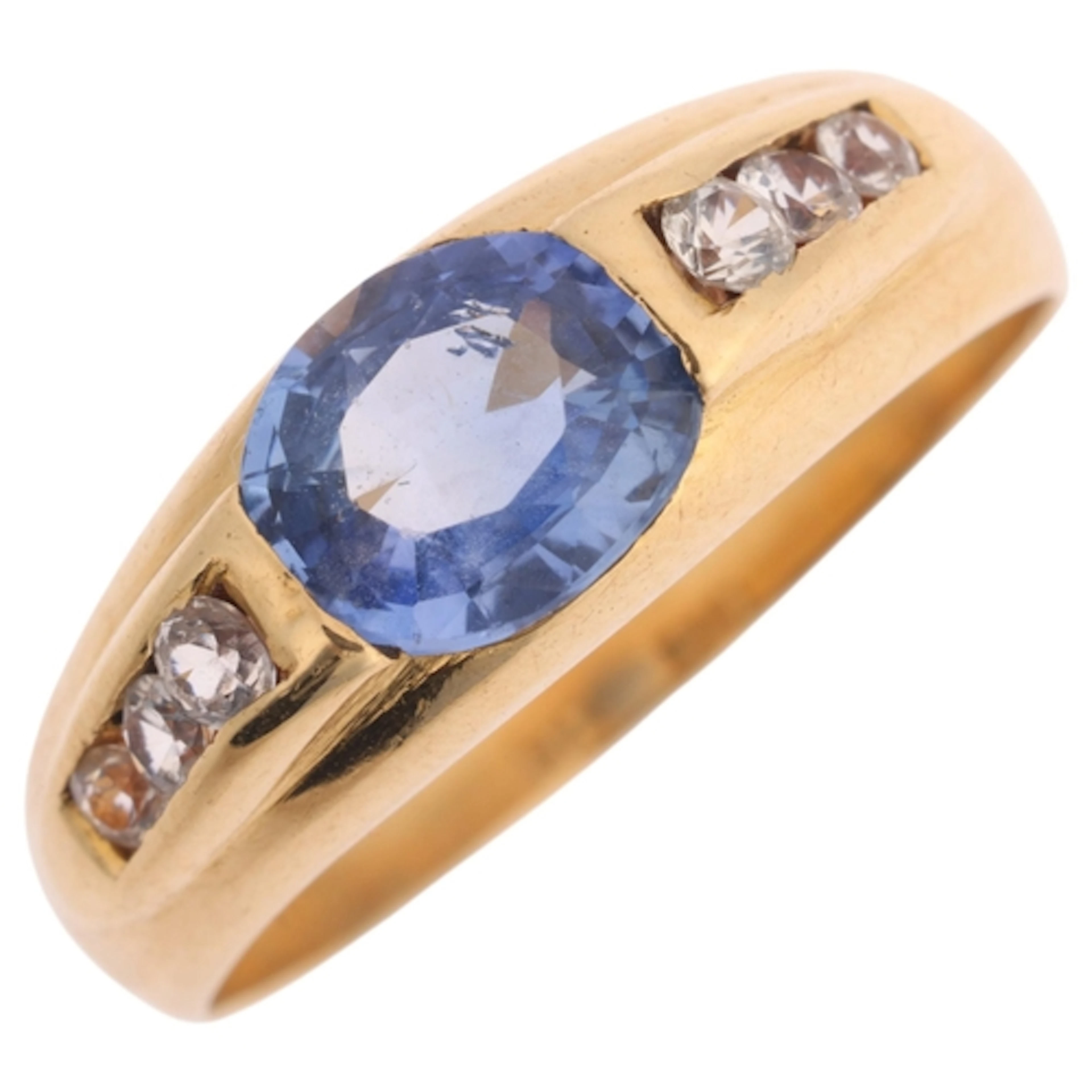 An 18ct gold sapphire and white sapphire ring, rub-over set ...