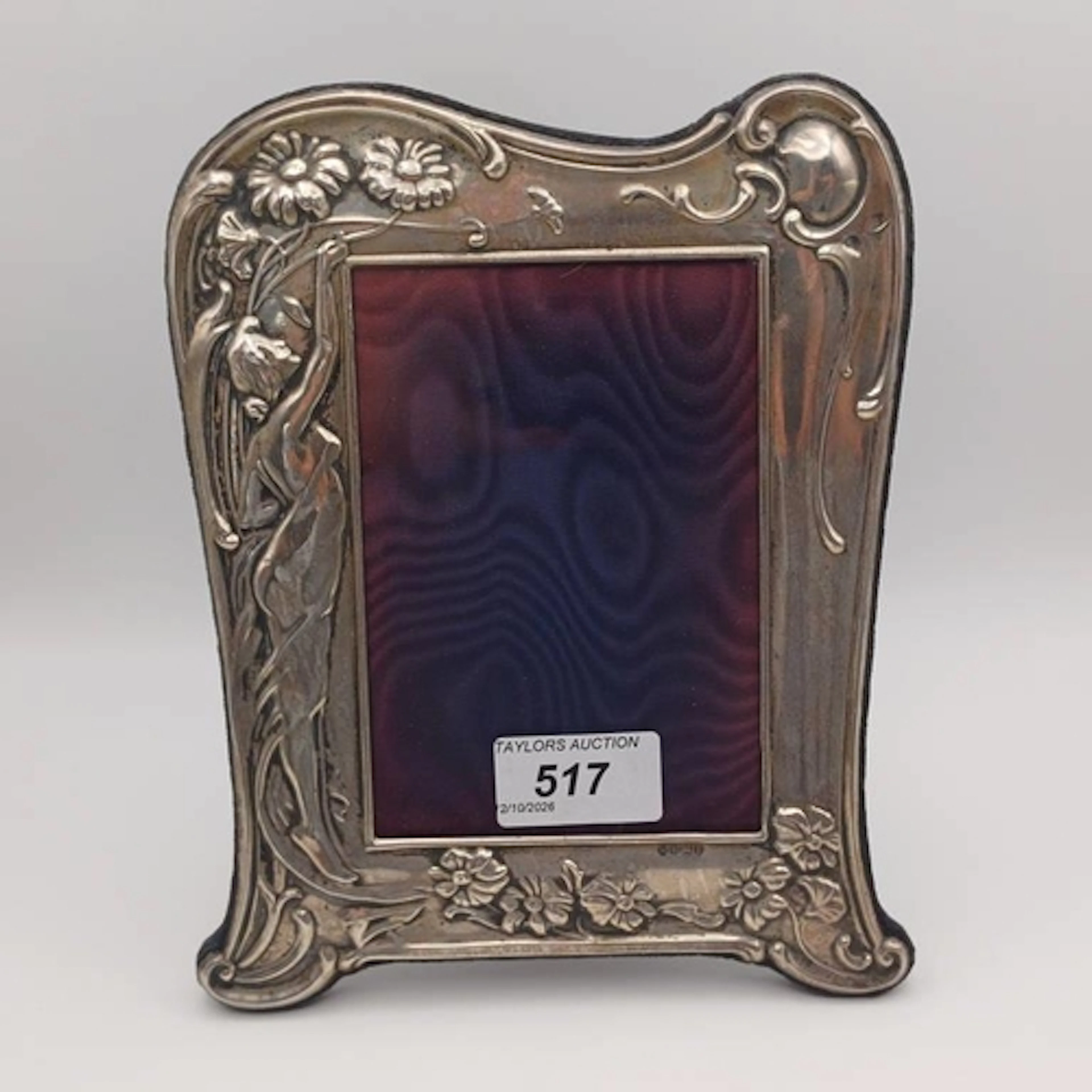 AN ART NOUVEAU STYLE SILVER PHOTO FRAME WITH EMBOSSED LADY &...