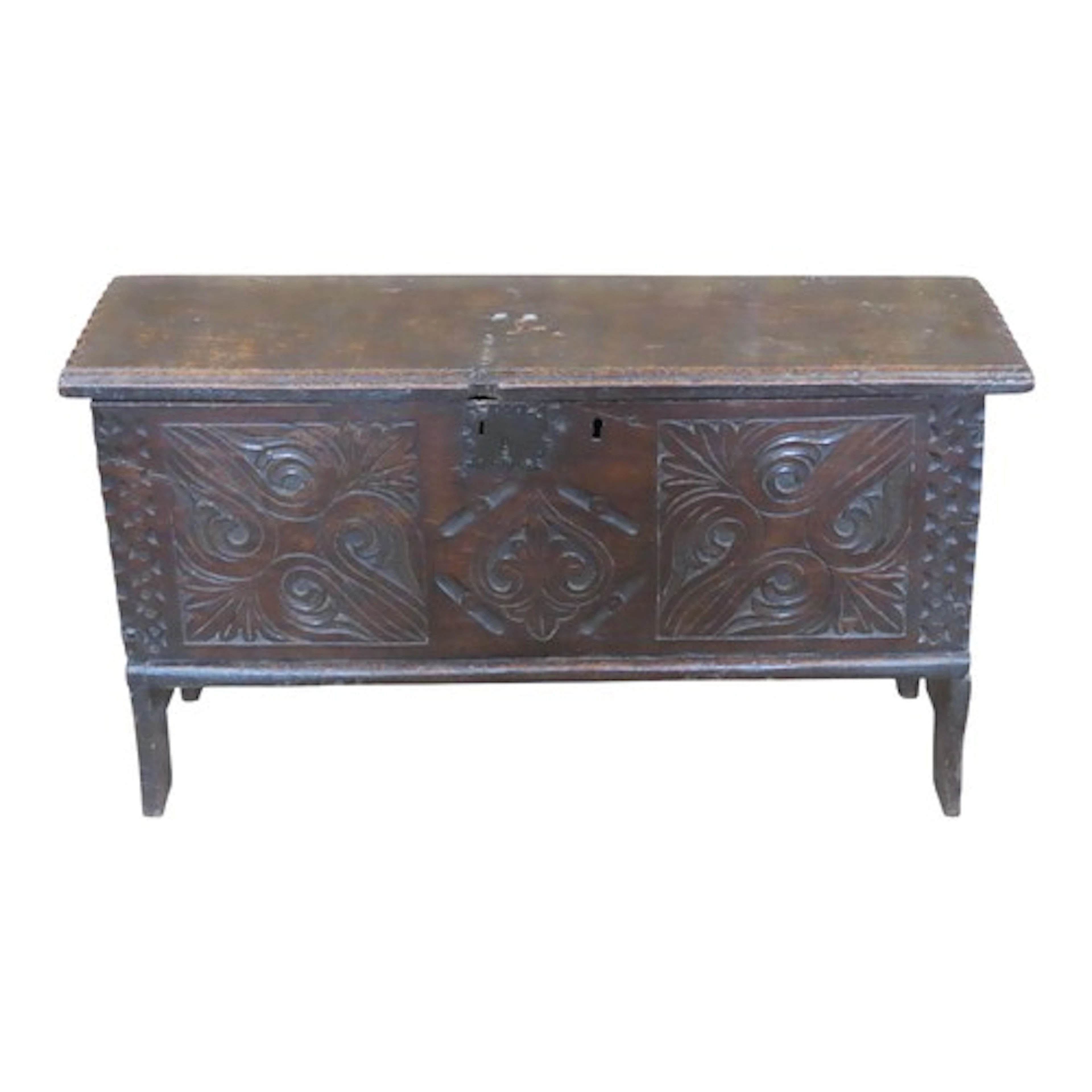 A small 17th century oak six plank coffer with hinged lid o...
