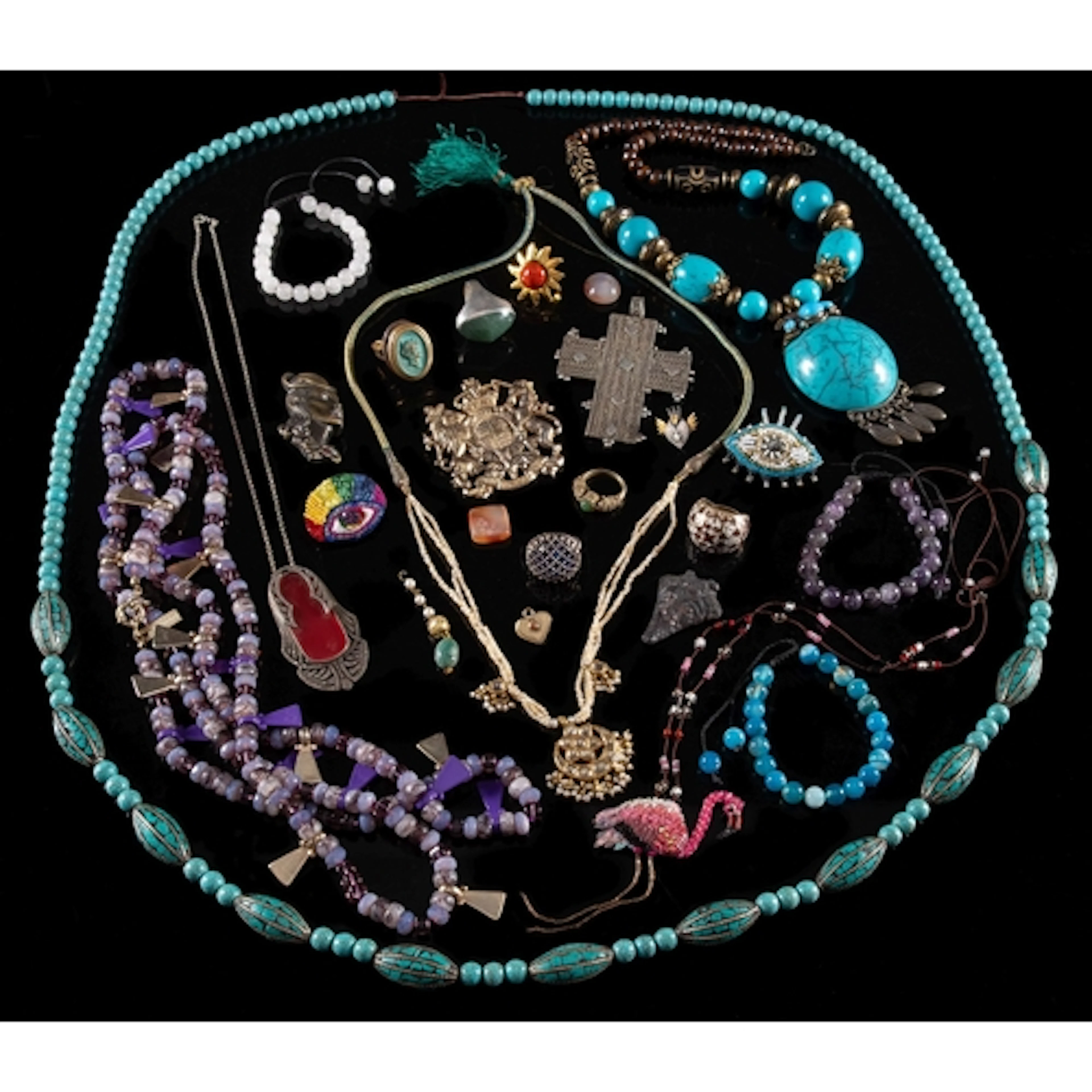 A mixed collection of costume jewellery, including a purple ...