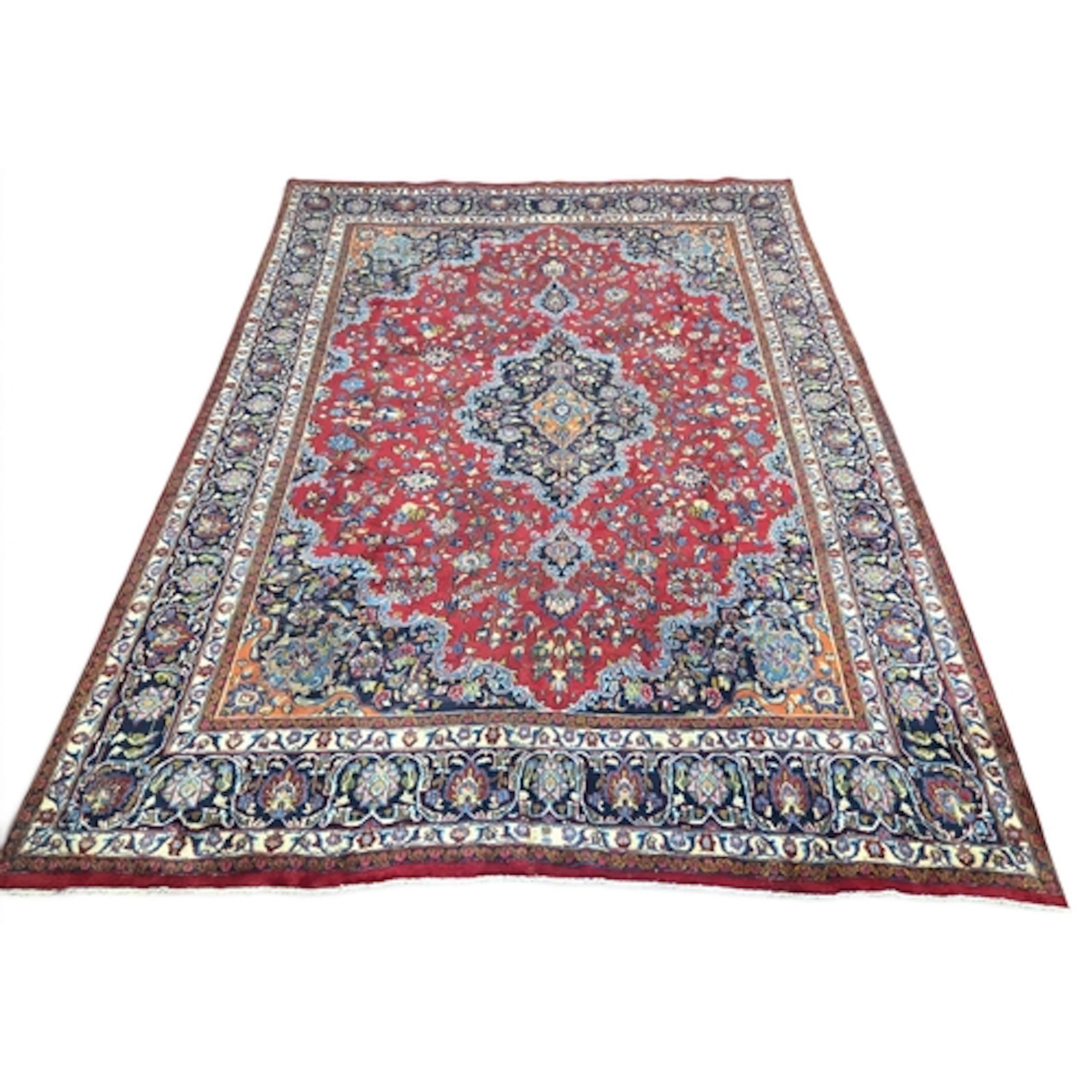 A full pile hand woven Persian Heriz Carpet with a tradition...