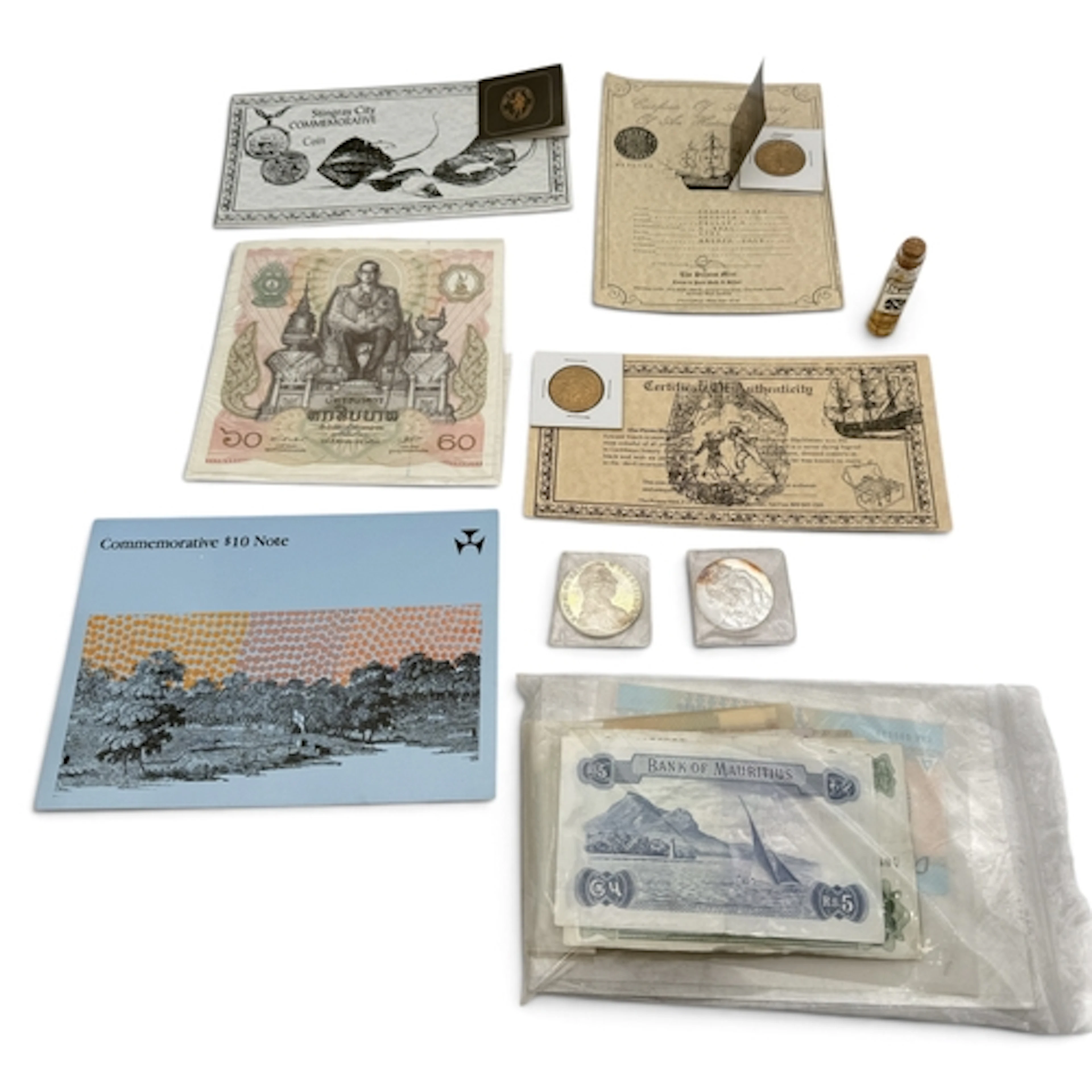 A GROUP OF COINS AND BANK NOTES To include a silver thaler a...
