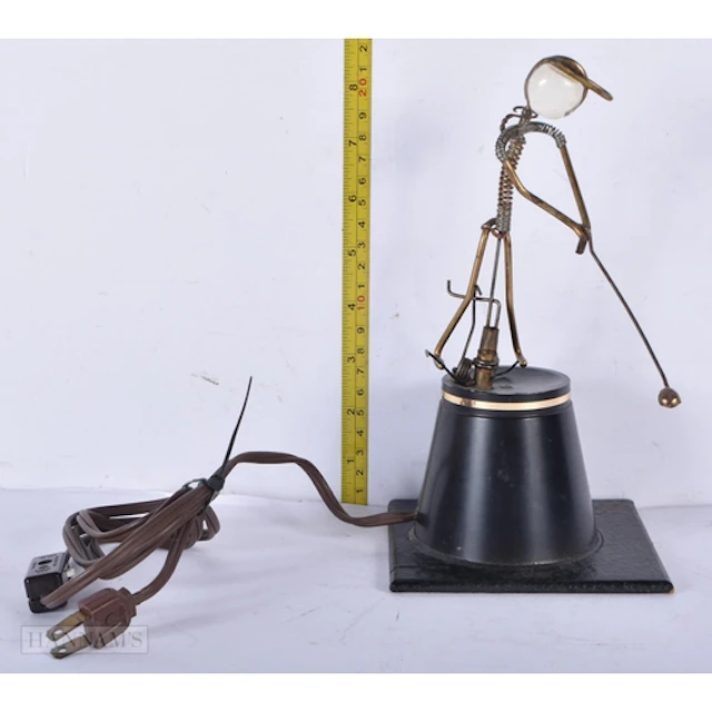 A vintage electric kinetic sculpture "The Golfer" by George ...