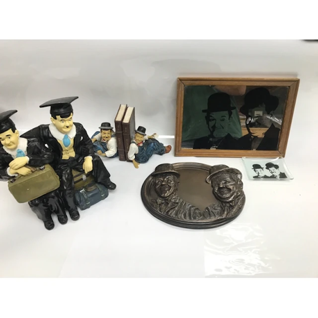 Collection of Laurel and Hardy items including oval wal...