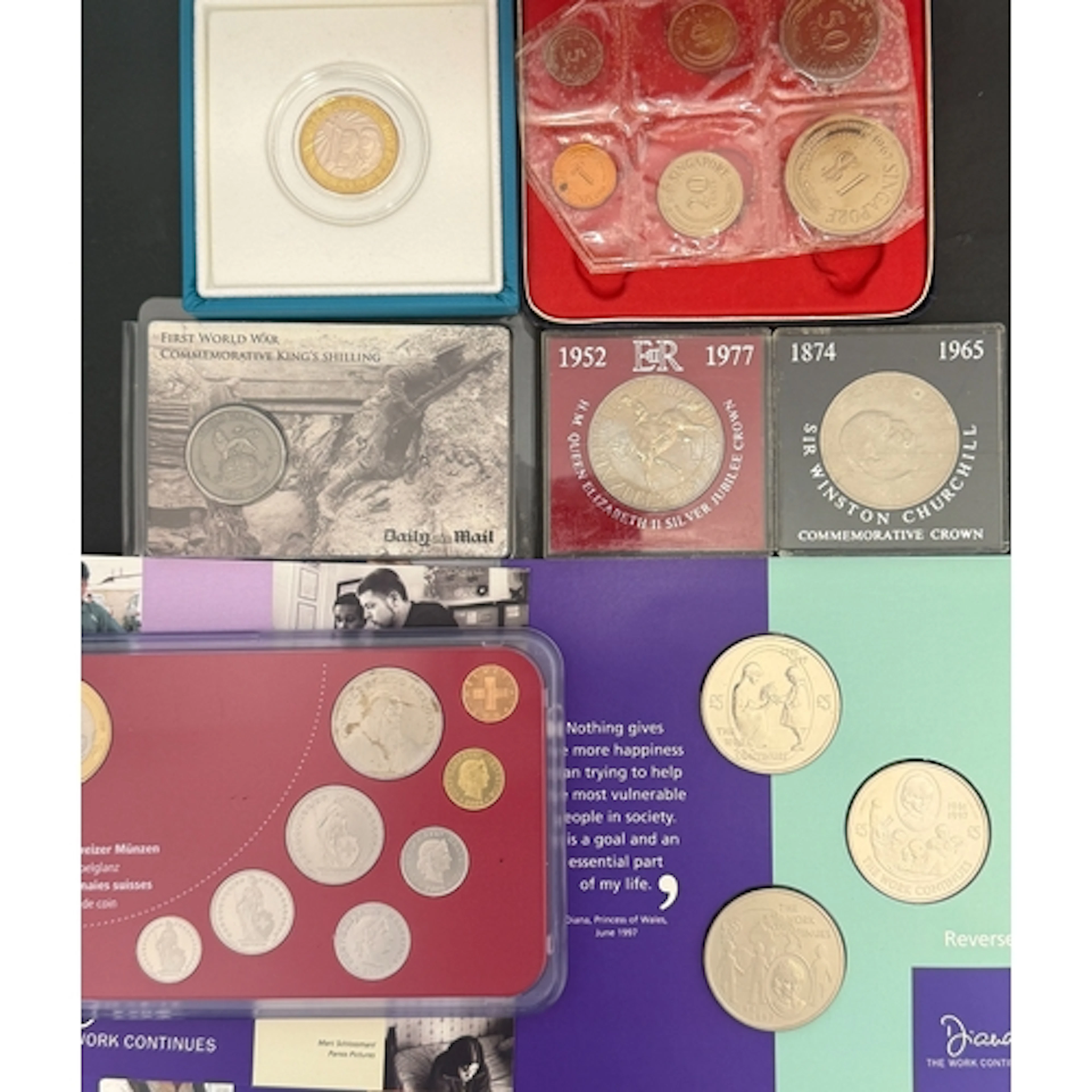 A group of over 30 World commemorative cupro-nickel coin set...