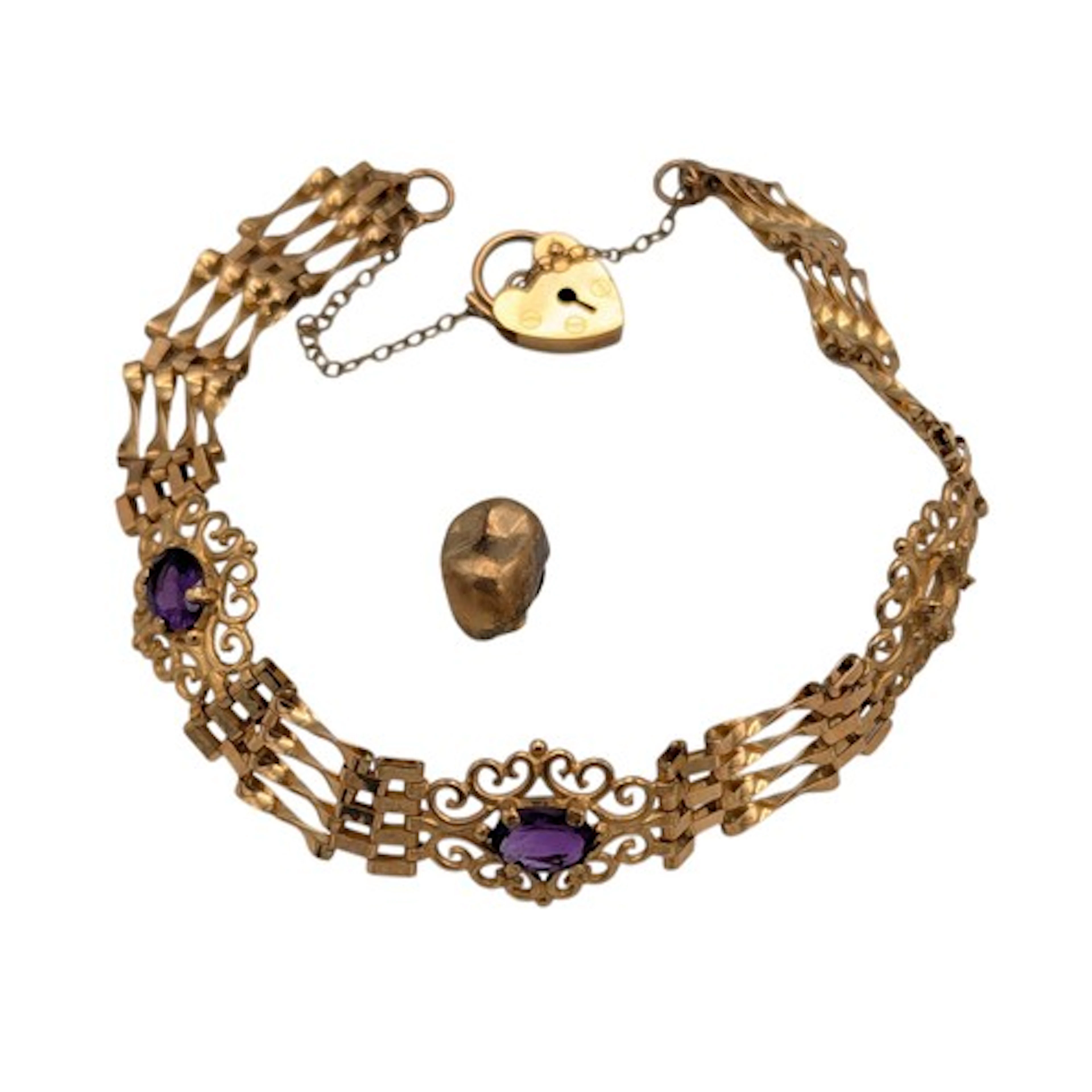 A 9ct gold and amethyst fancy gate link bracelet , marked 37...