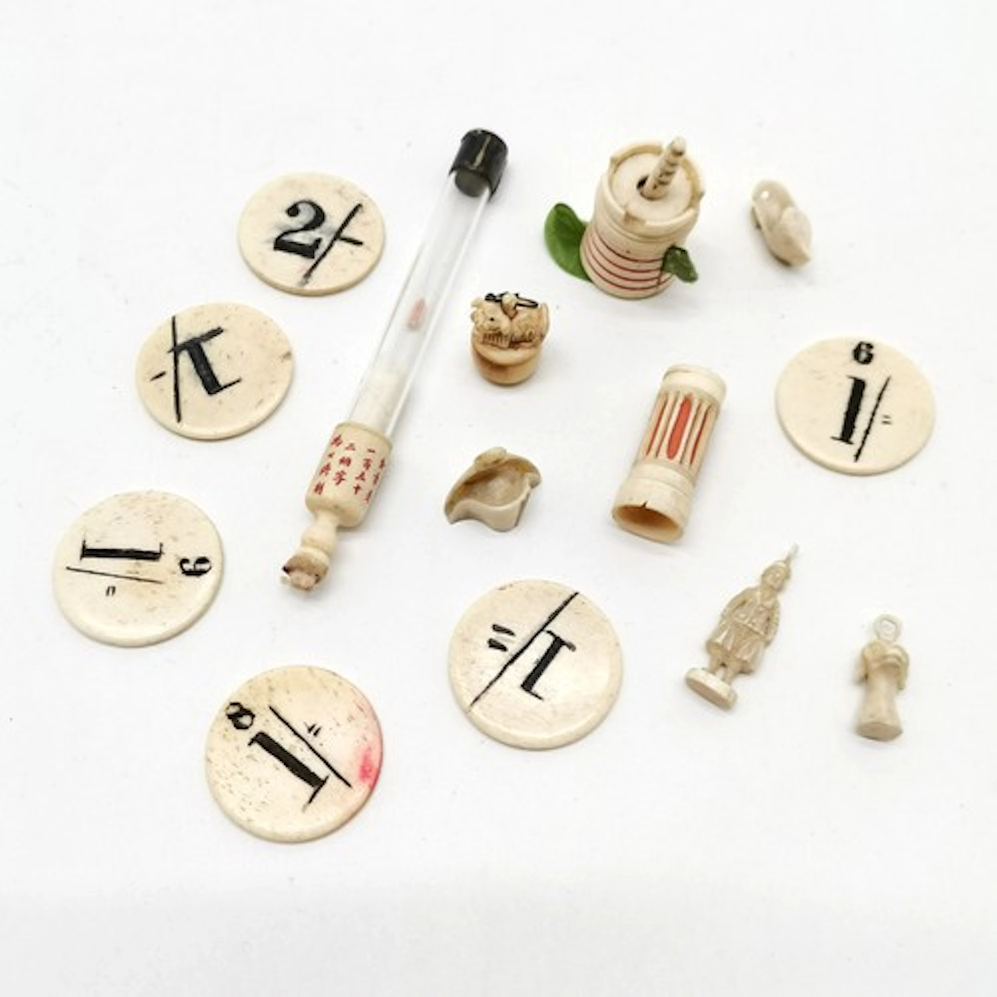 Collection of antique Oriental bone items incl. tape measure...