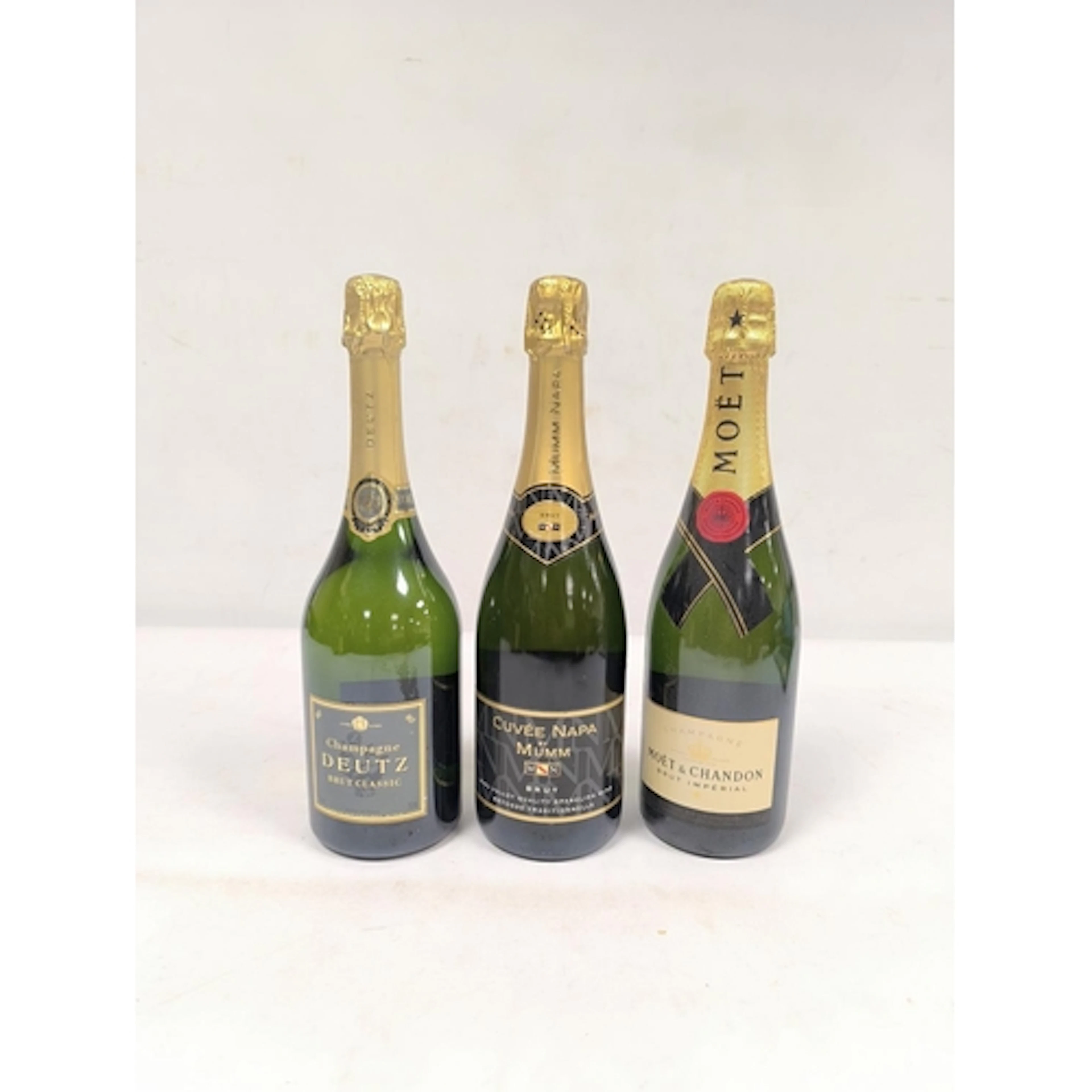 Three bottles of Champagne to include Moet & Chandon Bru...