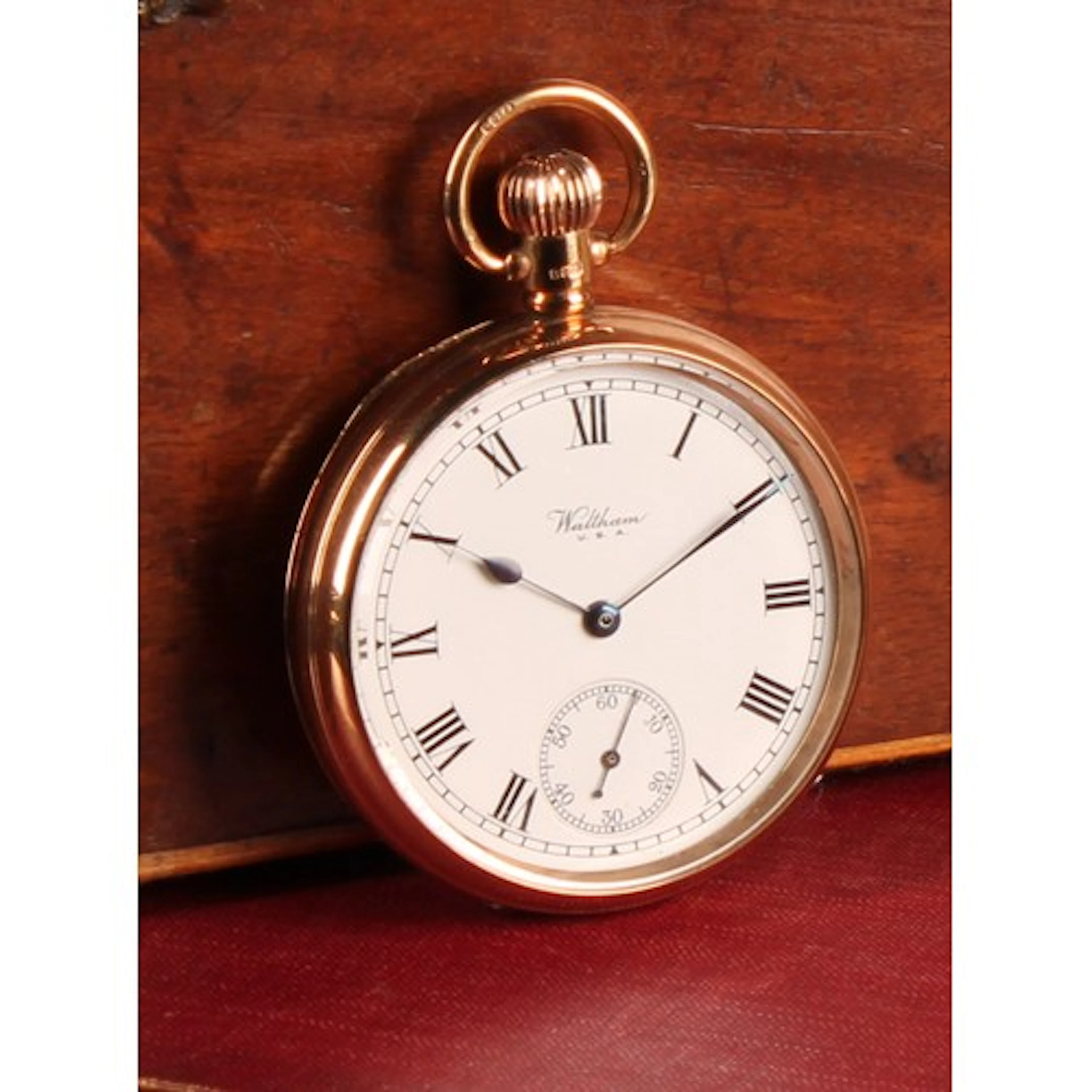 A Waltham 9ct gold open face pocket watch, white enamel dial...