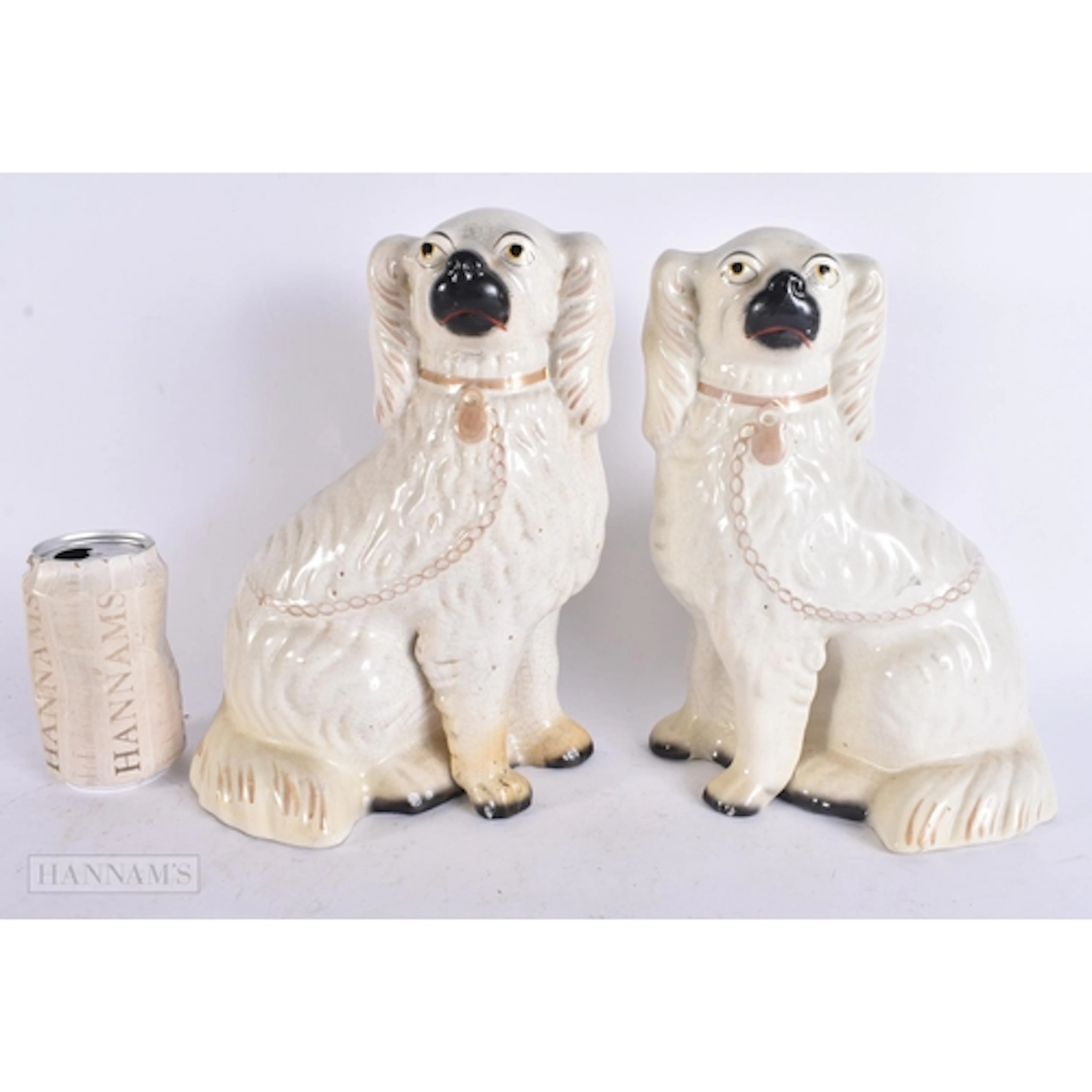 A PAIR OF VICTORIAN WHITE STAFFORDSHIRE DOGS. 27 cm x 14 cm.